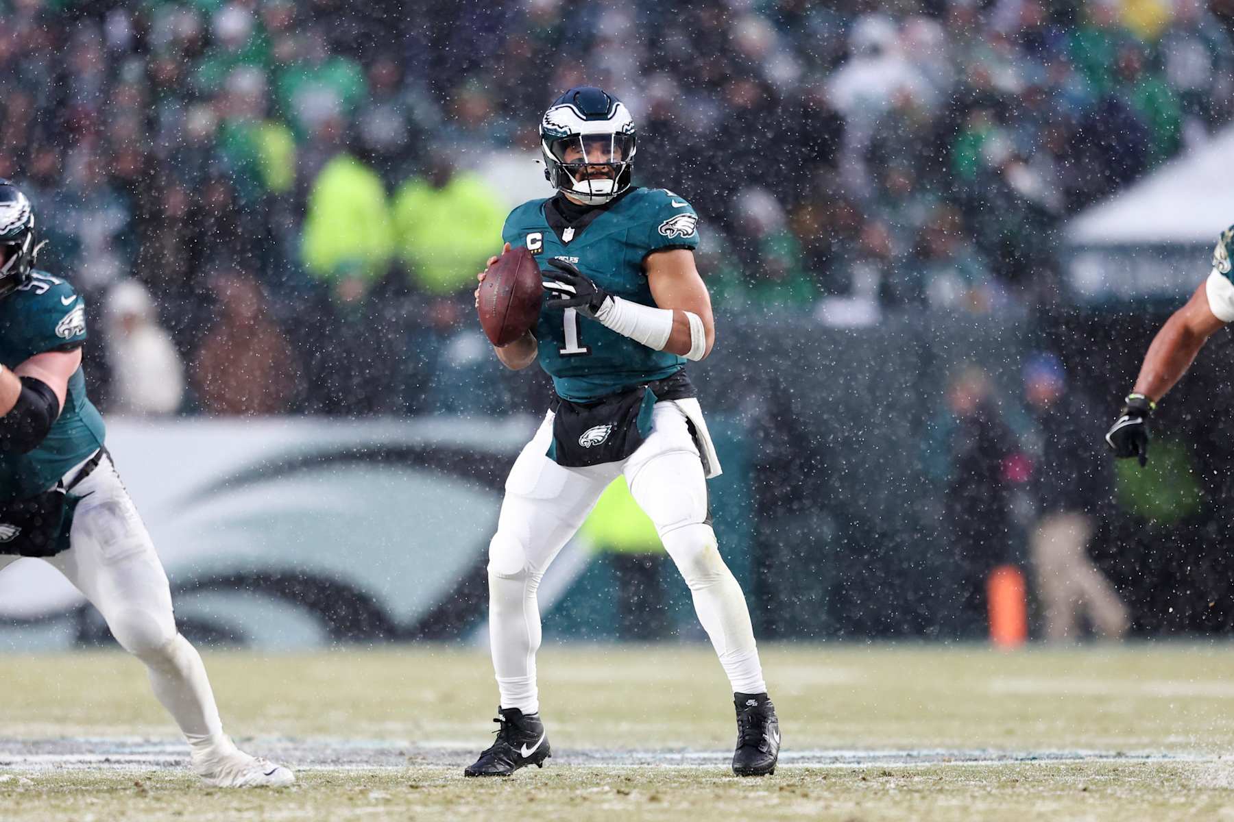 PHILADELPHIA, PENNSYLVANIA - JANUARY 19: Jalen Hurts #1 of the Philadelphia Eagles drops back to pass during the NFC Divisional playoff game against the Los Angeles Rams at Lincoln Financial Field on January 19, 2025 in Philadelphia, Pennsylvania. The Eagles defeated the Rams 28-22. (Kara Durrette/Getty Images)