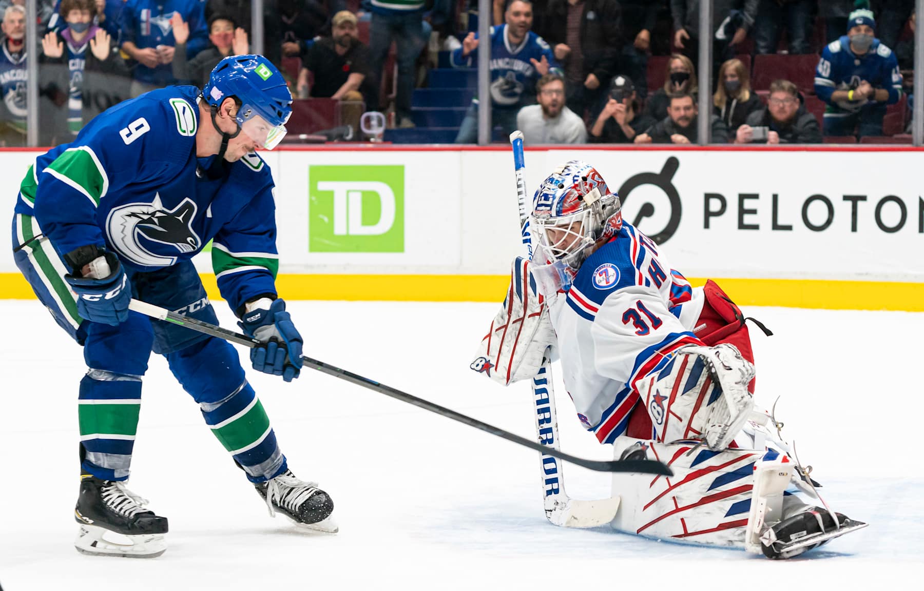 VANCOUVER, BC - NOVEMBER 2: Goalie Igor Shesterkin #31 of the New York Rangers stops J.T. Miller #9 of the Vancouver Canucks during the overtime period on November, 2, 2021 at Rogers Arena in Vancouver, British Columbia, Canada. (Photo by Rich Lam/Getty Images)