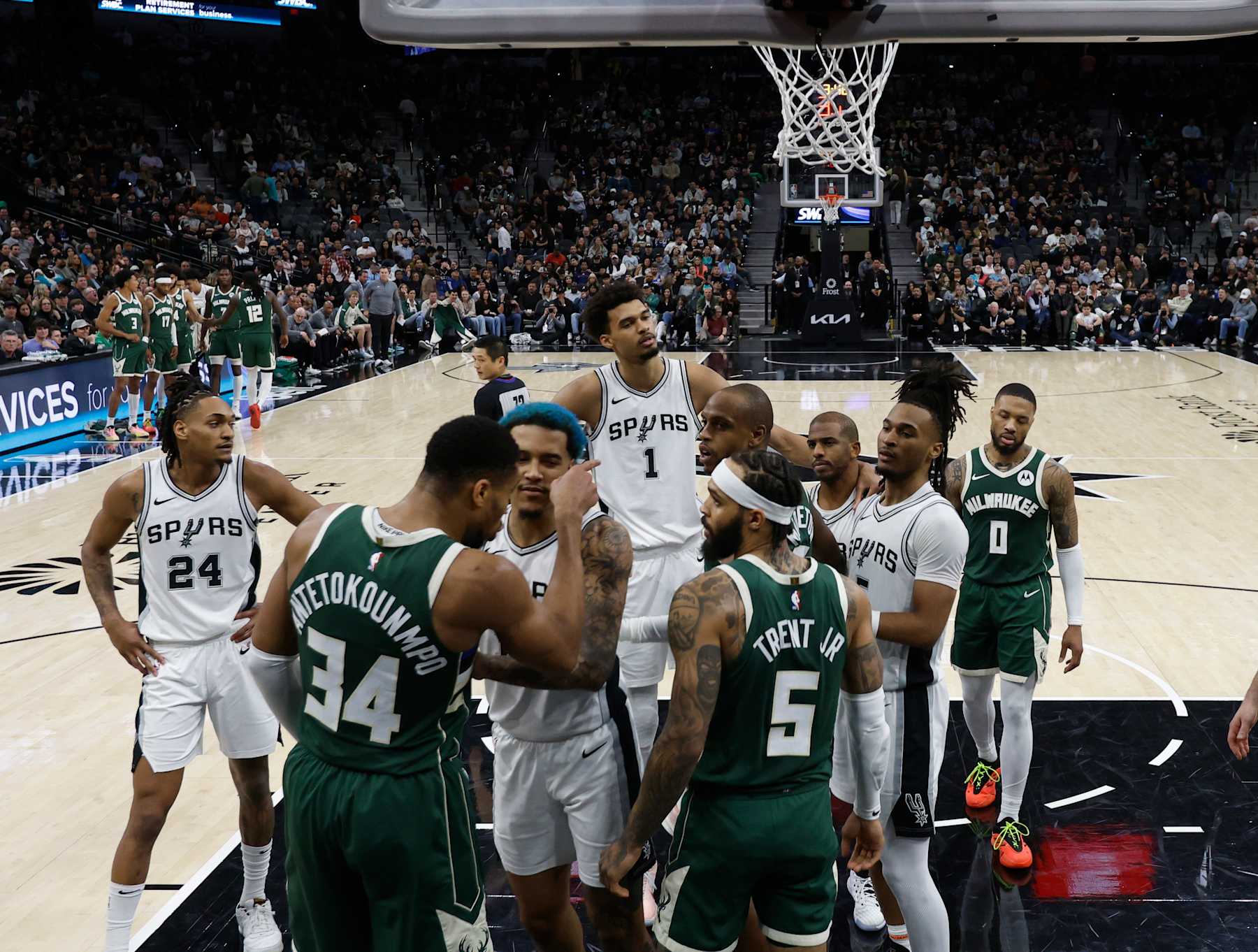 SAN ANTONIO, TX - JANUARY 31: Jeremy Sochan #10 of the San Antonio Spurs restrains Giannis Antetokounmpo #34 of the Milwaukee Bucks from going after Chris Paul #3  in the second half at Frost Bank Center on January 31, 2025 in San Antonio, Texas. NOTE TO USER: User expressly acknowledges and agrees that, by downloading and or using this photograph, User is consenting to terms and conditions of the Getty Images License Agreement. (Photo by Ronald Cortes/Getty Images)