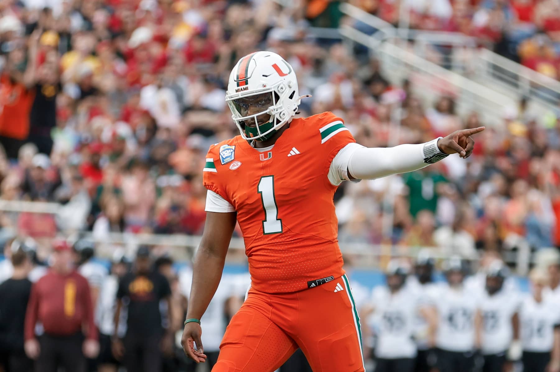 ORLANDO, FL - DECEMBER 28: Miami Hurricanes quarterback Cam Ward (1) reacts after throwing a touchdown pass during the game between the Miami Hurricanes and the Iowa State Cyclones on December 28, 2024 at Camping World Stadium in Orlando, Fl. (Photo by David Rosenblum/Icon Sportswire via Getty Images)