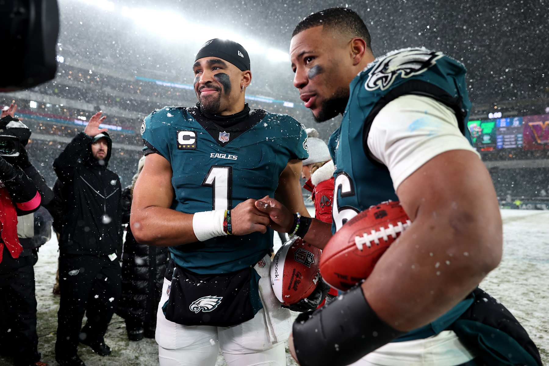 PHILADELPHIA, PENNSYLVANIA - JANUARY 19: (L-R) Jalen Hurts #1 and Saquon Barkley #26 of the Philadelphia Eagles react after defeating the Los Angeles Rams 28-22 in the NFC Divisional Playoff at Lincoln Financial Field on January 19, 2025 in Philadelphia, Pennsylvania. (Photo by Sarah Stier/Getty Images)