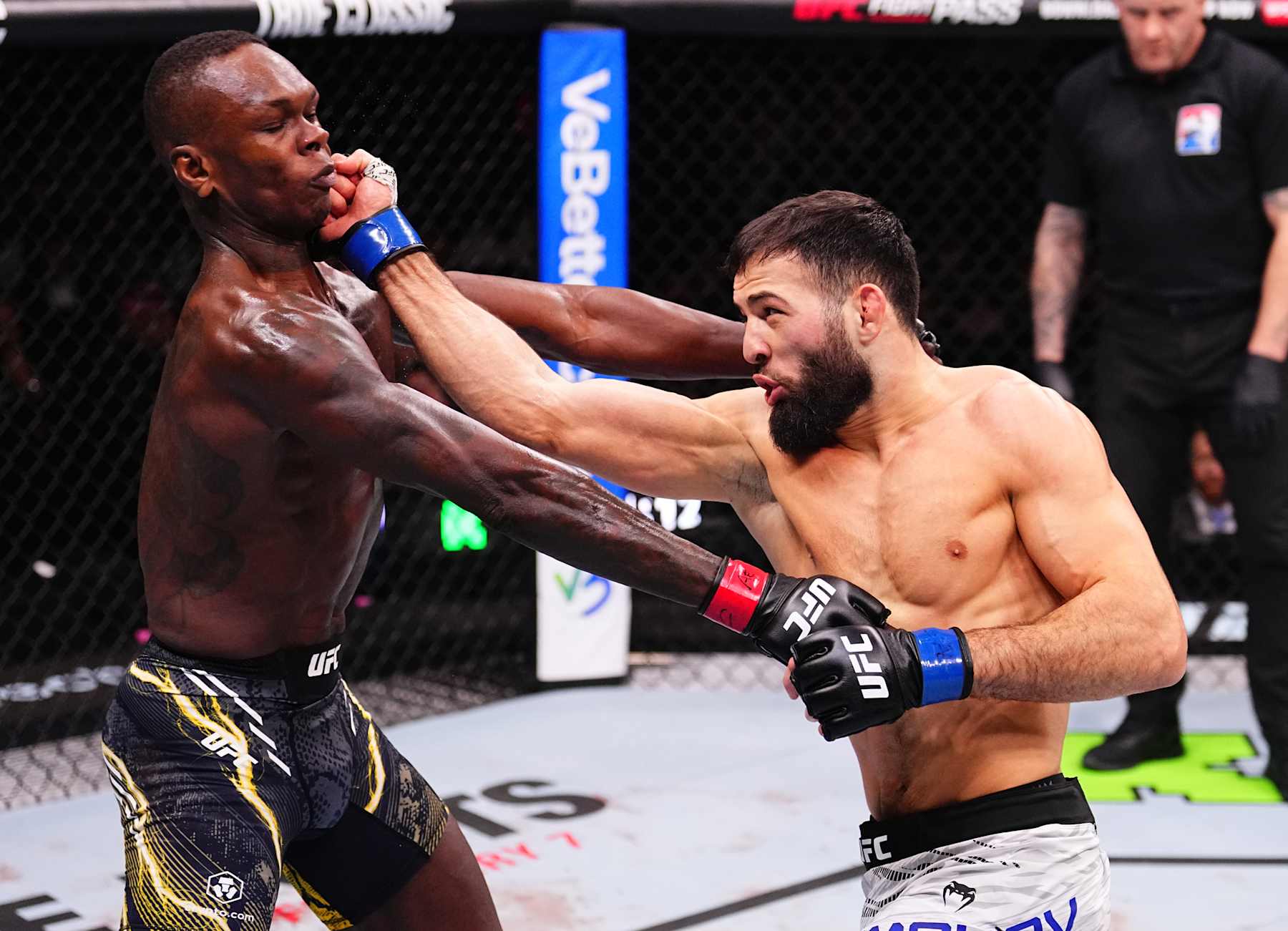 RIYADH, SAUDI ARABIA - FEBRUARY 01: (R-L) Nassourdine Imavov of Russia punches Israel Adesanya of Nigeria in a middleweight fight during the UFC Fight Night event at anb Arena on February 01, 2025 in Riyadh, Saudi Arabia. (Photo by Chris Unger/Zuffa LLC)