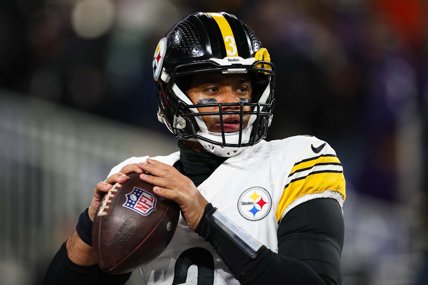 BALTIMORE, MD - JANUARY 11: Russell Wilson #3 of the Pittsburgh Steelers attempts a pass before the AFC Wild Card Playoff game against the Baltimore Ravens at M&T Bank Stadium on January 11, 2025 in Baltimore, Maryland. (Photo by Scott Taetsch/Getty Images)