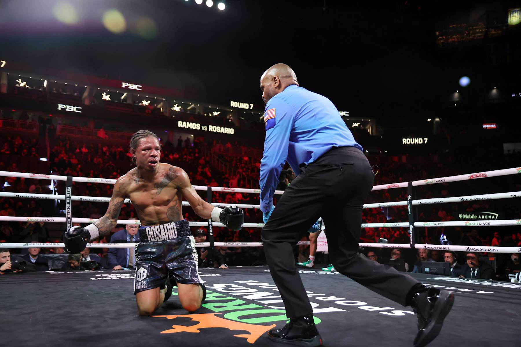 LAS VEGAS, NEVADA - FEBRUARY 01: Jeison Rosario reacts after being knocked down in the seventh round by Jesus Ramos Jr. during a middleweight bout at T-Mobile Arena on February 01, 2025 in Las Vegas, Nevada. Referee Robert Hoyle checks on Rosario at right. Ramos won by TKO in the eighth round. (Photo by Steve Marcus/Getty Images)