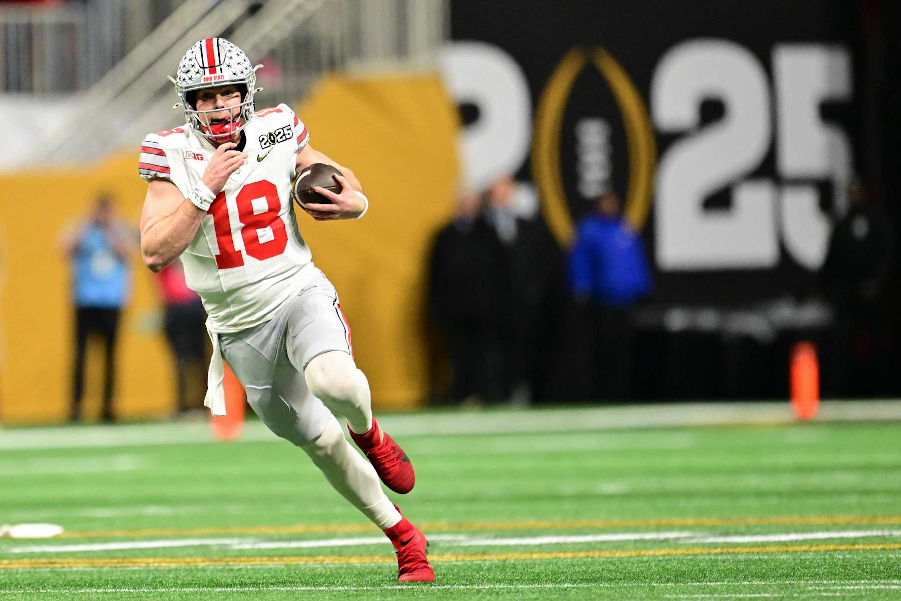 ATLANTA, GEORGIA - JANUARY 20: Will Howard #18 of the Ohio State Buckeyes runs the ball during the second quarter of the 2025 CFP National Championship Game against the Notre Dame Fighting Irish at Mercedes-Benz Stadium on January 20, 2025 in Atlanta, Georgia. (Photo by CFP/Getty Images)