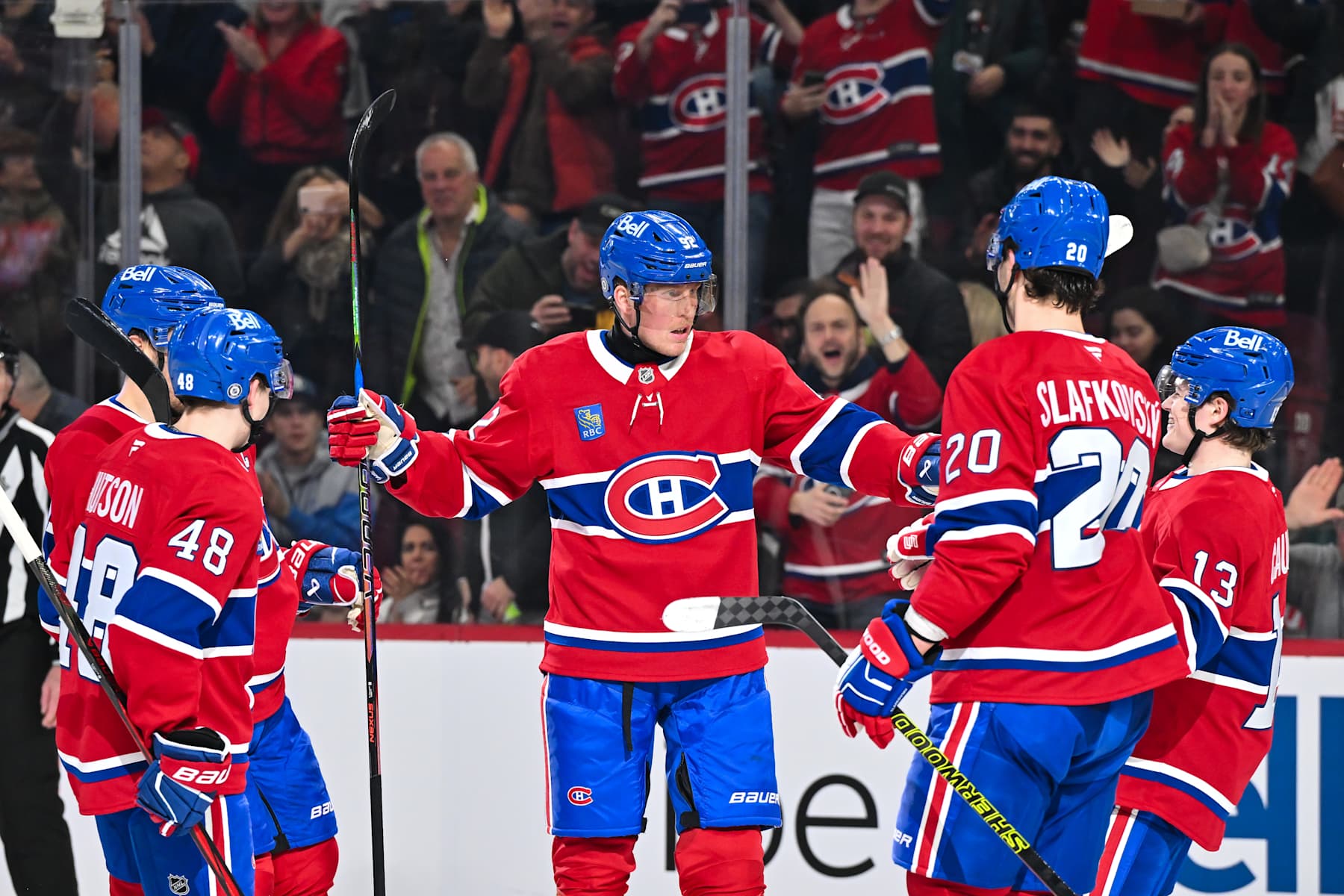 MONTREAL, CANADA - DECEMBER 17: Patrik Laine #92 of the Montreal Canadiens celebrates his 2nd goal of the game with teammates Lane Hutson #48, Juraj Slafkovsky #20 and Cole Caufield #13 during the second period against the Buffalo Sabres at the Bell Centre on December 17, 2024 in Montreal, Quebec, Canada. (Photo by Minas Panagiotakis/Getty Images)