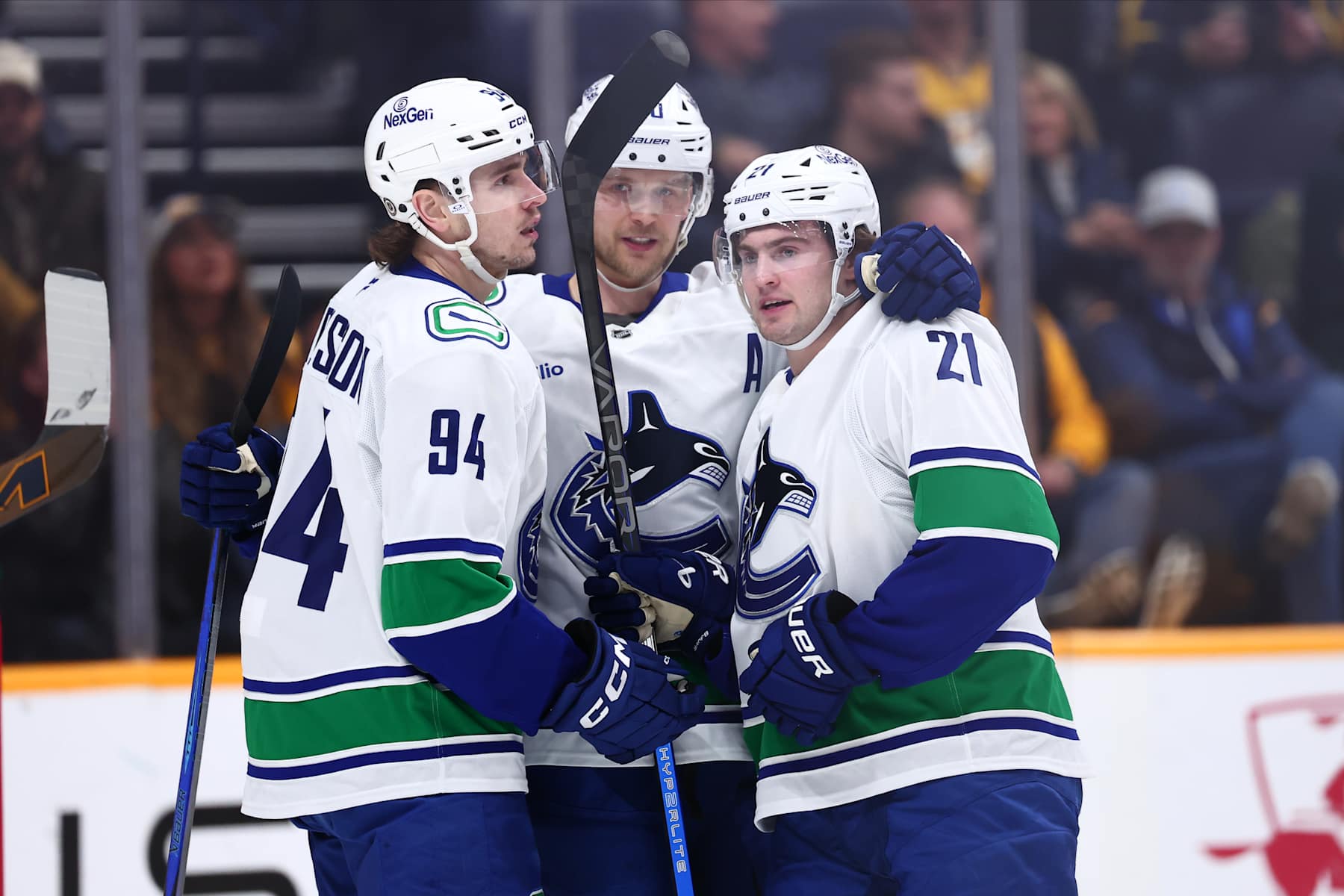 NASHVILLE, TENNESSEE - JANUARY 29: Elias Pettersson #40, Nils Hoglander #21, and Linus Karlsson #94 of the Vancouver Canucks celebrate a goal in the first period against the Nashville Predators on January 29, 2025 at Bridgestone Arena in Nashville. (Photo by Casey Gower/NHLI via Getty Images)