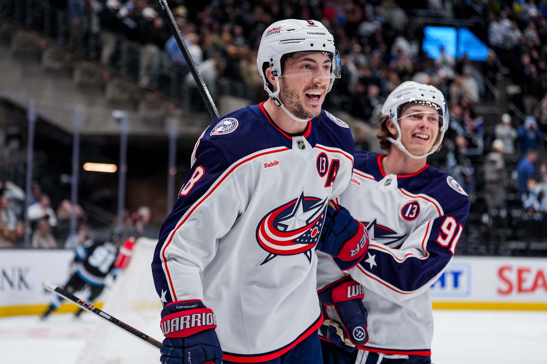 SALT LAKE CITY, UTAH - JANUARY 31: Zach Werenski #8 of the Columbus Blue Jackets and Kent Johnson #91 of the Columbus Blue Jackets celebrate a goal during overtime against the Utah Hockey Club on January 31, 2025 at Delta Center in Salt Lake City, Utah. (Photo by Hunter Dyke/NHLI via Getty Images)