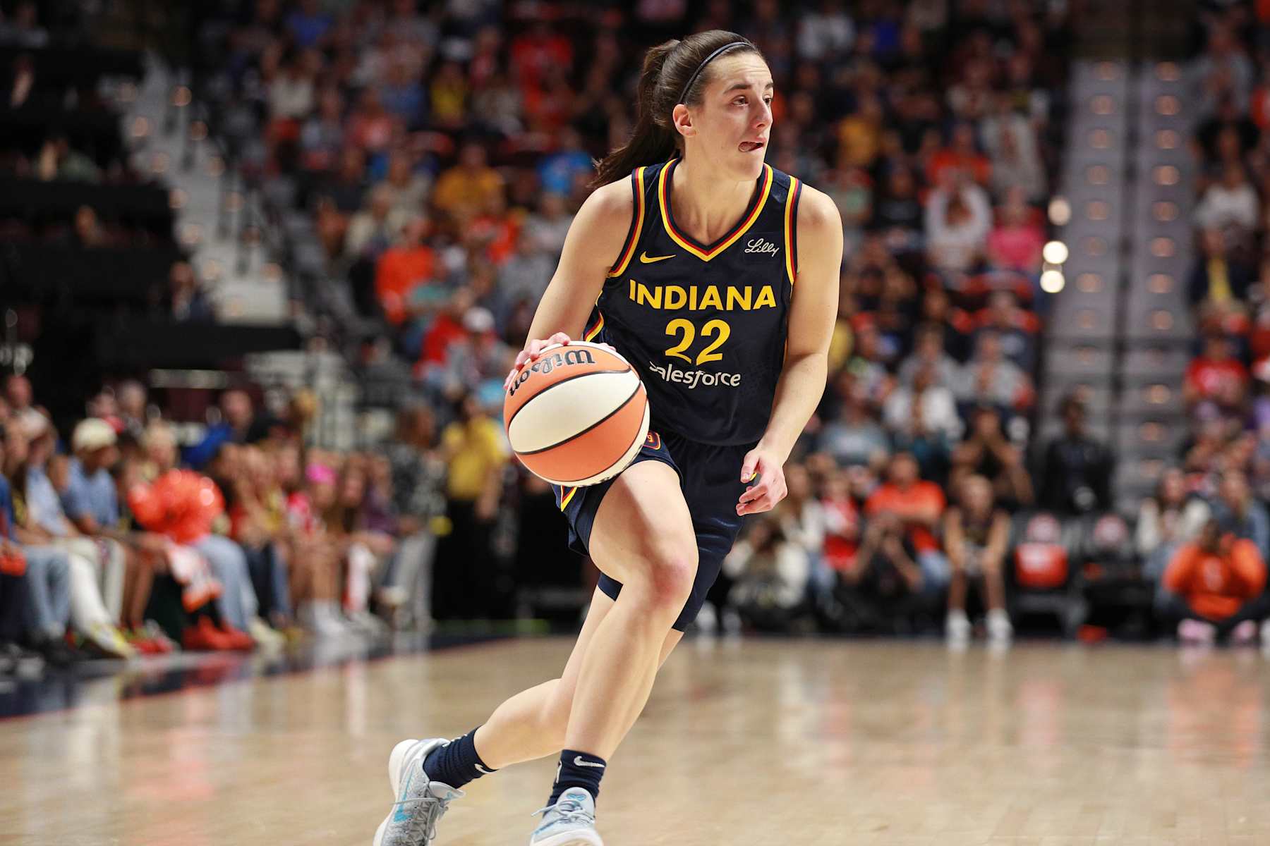 UNCASVILLE, CT - SEPTEMBER 22: Caitlin Clark #22 of the Indiana Fever dribbles the ball during the game against the Connecticut Sun during round one game one of the 2024 WNBA Playoffs on September 22, 2024 at the Mohegan Sun Arena in Uncasville, Connecticut. NOTE TO USER: User expressly acknowledges and agrees that, by downloading and or using this photograph, User is consenting to the terms and conditions of the Getty Images License Agreement. Mandatory Copyright Notice: Copyright 2024 NBAE (Photo by Chris Marion/NBAE via Getty Images)