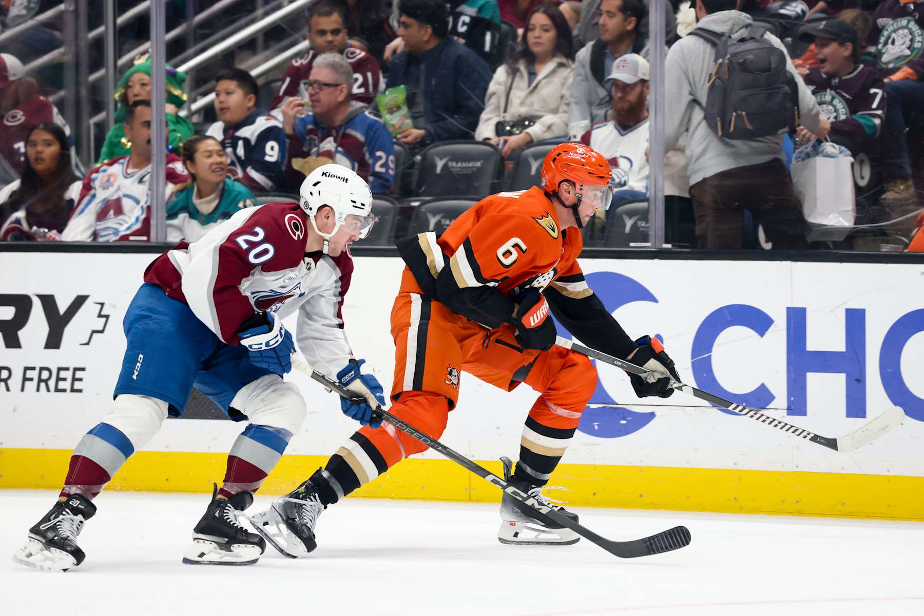 ANAHEIM, CA - DECEMBER 20: Ross Colton #20 of the Colorado Avalanche and Brian Dumoulin #6 of the Anaheim Ducks battle for position during the second period at Honda Center on December 20, 2024 in Anaheim, California. (Photo by Debora Robinson/NHLI via Getty Images)