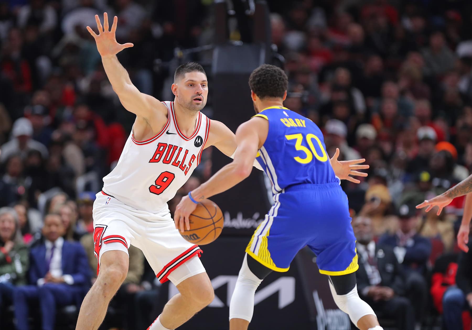 CHICAGO, IL - JANUARY 12: Nikola Vucevic #9 of the Chicago Bulls guards Stephen Curry #30 of the Golden State Warriors during the second half at the United Center on January 12, 2024 in Chicago, Illinois. (Photo by Melissa Tamez/Icon Sportswire via Getty Images)