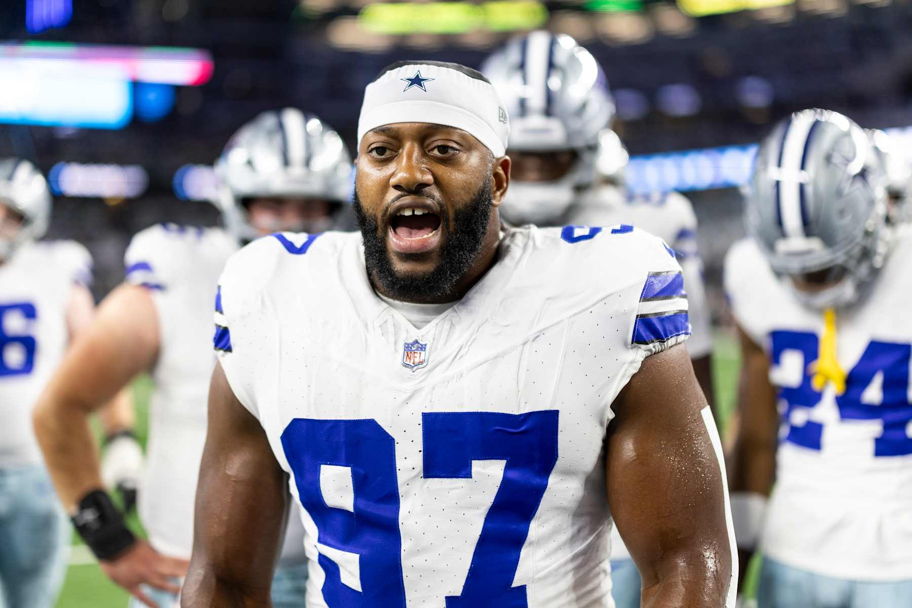 ARLINGTON, TEXAS - NOVEMBER 18: Osa Odighizuwa #97 of the Dallas Cowboys reacts as he leads a huddle during an NFL Football game against the Houston Texans at AT&T Stadium on November 18, 2024 in Arlington, Texas. (Photo by Michael Owens/Getty Images)
