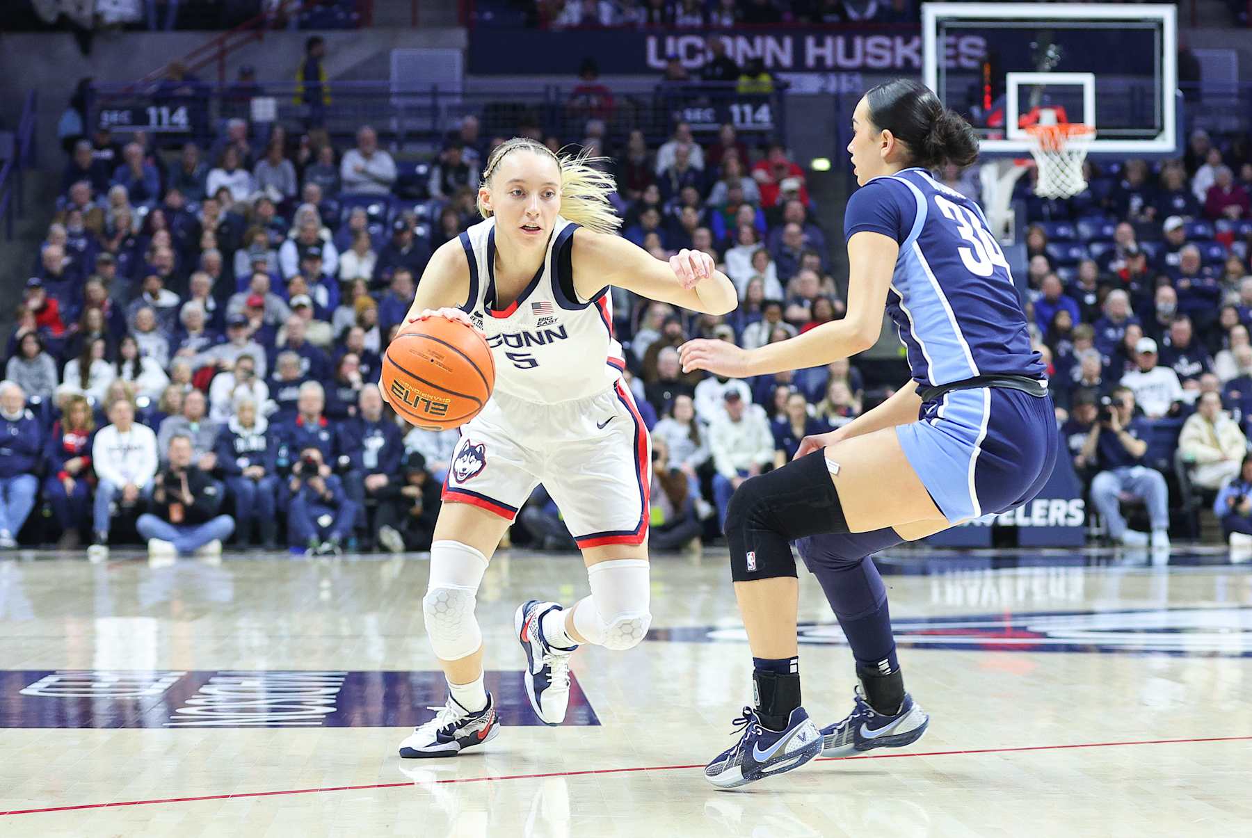 STORRS, CT - JANUARY 22: UConn Huskies guard Paige Bueckers (5) drives to the basket against Villanova Wildcats guard Maddie Webber (34) during the women's college basketball game between Villanova Wildcats and UConn Huskies on January 22, 2025, at Harry A. Gampel Pavilion in Storrs, CT. (Photo by M. Anthony Nesmith/Icon Sportswire via Getty Images)