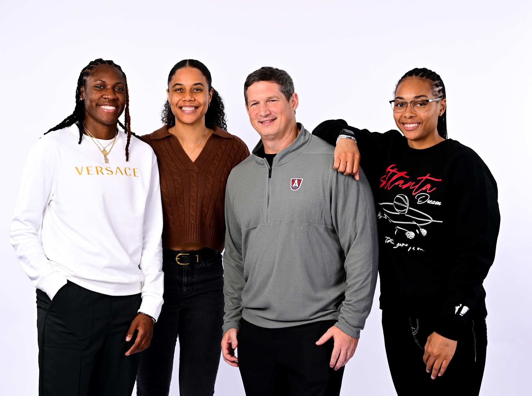 ATLANTA, GA - NOVEMBER 19: Rhyne Howard, Nia Coffey, Karl Smesko, and Allisha Gray of the Atlanta Dream poses for a portrait during a introductory press conference at Signia Hotel on November 19th, 2024 in Atlanta, Georgia. NOTE TO USER: User expressly acknowledges and agrees that, by downloading and or using this Photograph, user is consenting to the terms and conditions of the Getty Images License Agreement. Mandatory Copyright Notice: Copyright 2024 NBAE (Photo by Adam Hagy/NBAE via Getty Images)