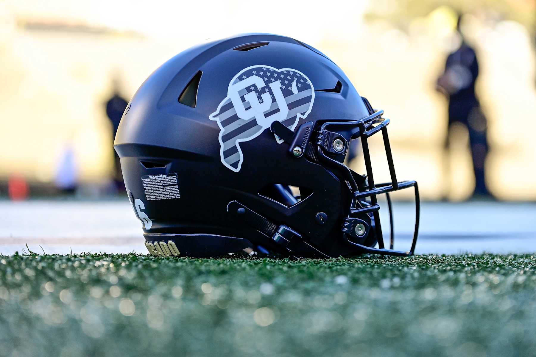 BOULDER, CO - NOVEMBER 16: A detail view of a Colorado Buffaloes helmet is seen on the field before a game between the Colorado Buffaloes and the Utah Utes at Folsom Field on November 16, 2024 in Boulder, Colorado. (Photo by Dustin Bradford/Getty Images)