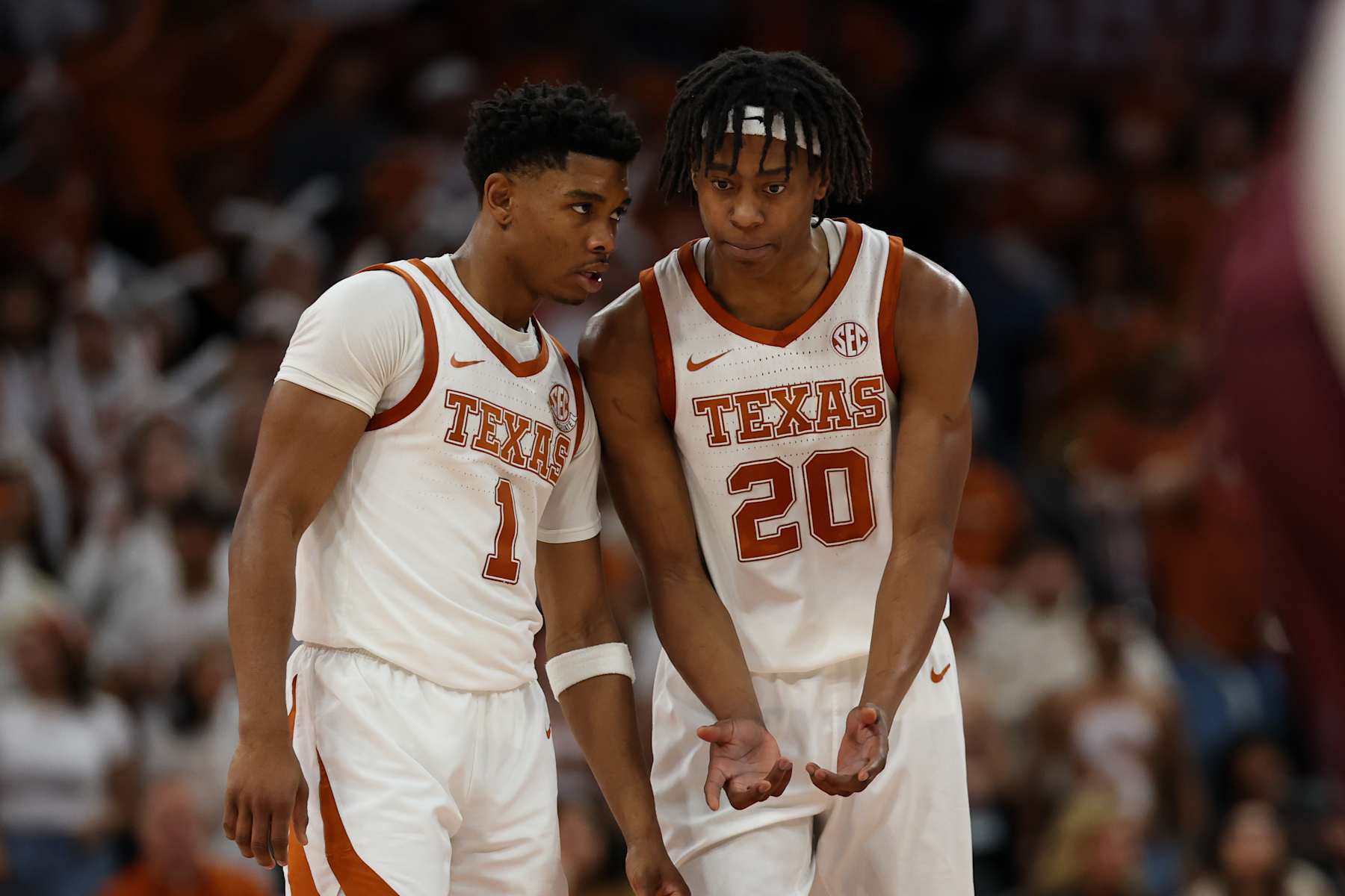 Texas' Tre Johnson and Julian Larry
