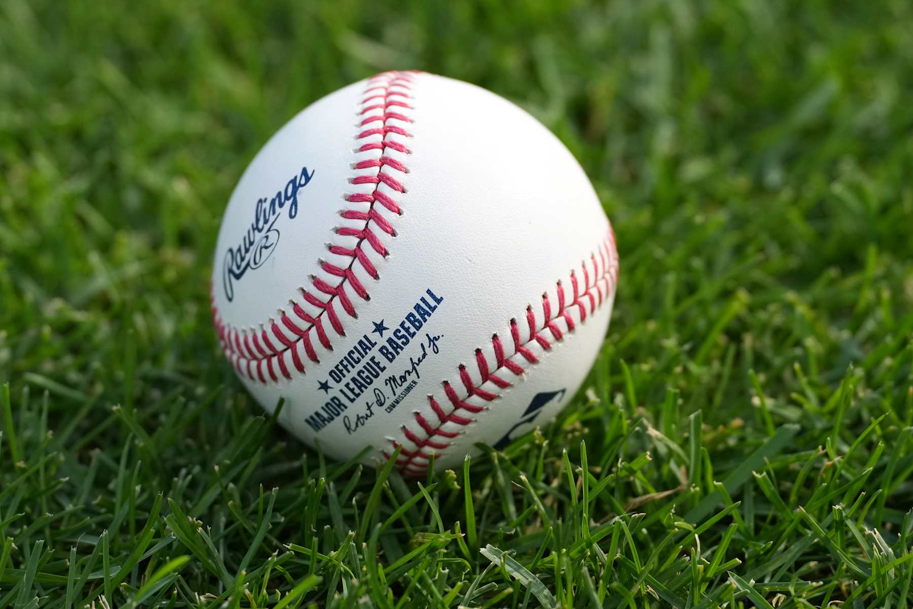 CINCINNATI, OHIO - SEPTEMBER 20: Rawlings baseball laying on the grass during batting practice before the game between the Cincinnati Reds and the Pittsburgh Pirates at Great American Ball Park on September 20, 2024 in Cincinnati, Ohio. (Photo by Jason Mowry/Getty Images)