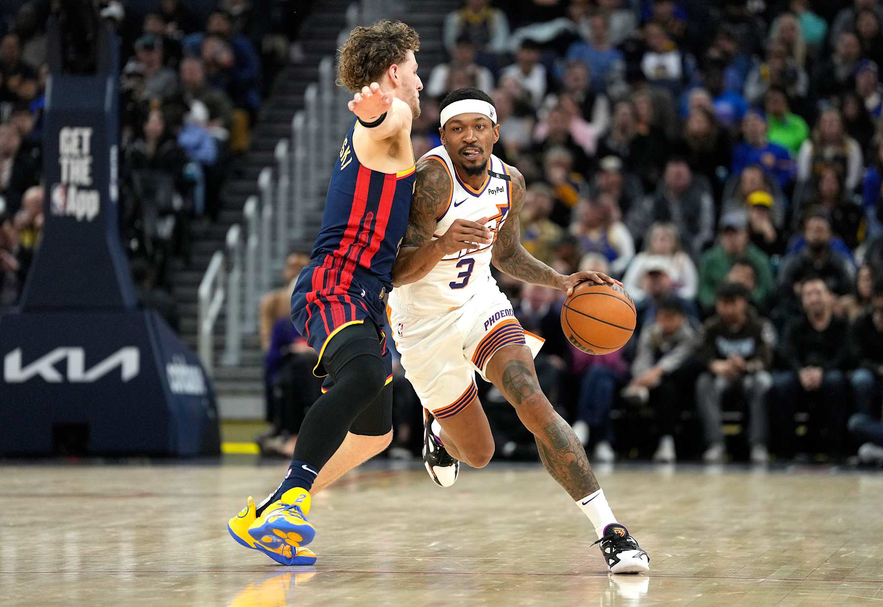 SAN FRANCISCO, CALIFORNIA - JANUARY 31: Bradley Beal #3 of the Phoenix Suns dribbling the ball is guarded by Brandin Podziemski #2 of the Golden State Warriors during the second half of an NBA basketball game at Chase Center on January 31, 2025 in San Francisco, California. NOTE TO USER: User expressly acknowledges and agrees that, by downloading and or using this photograph, User is consenting to the terms and conditions of the Getty Images License Agreement. (Photo by Thearon W. Henderson/Getty Images)