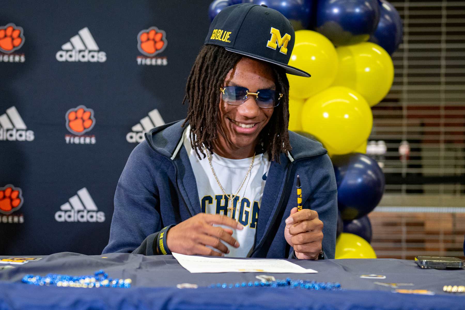 BELLEVILLE, MICHIGAN - DECEMBER 04: Four-star high school safety recruit Elijah Dotson signs his letter of intent to play for the Michigan Wolverines at Belleville High School on December 04, 2024 in Belleville, Michigan. (Photo by Aaron J. Thornton/Getty Images)