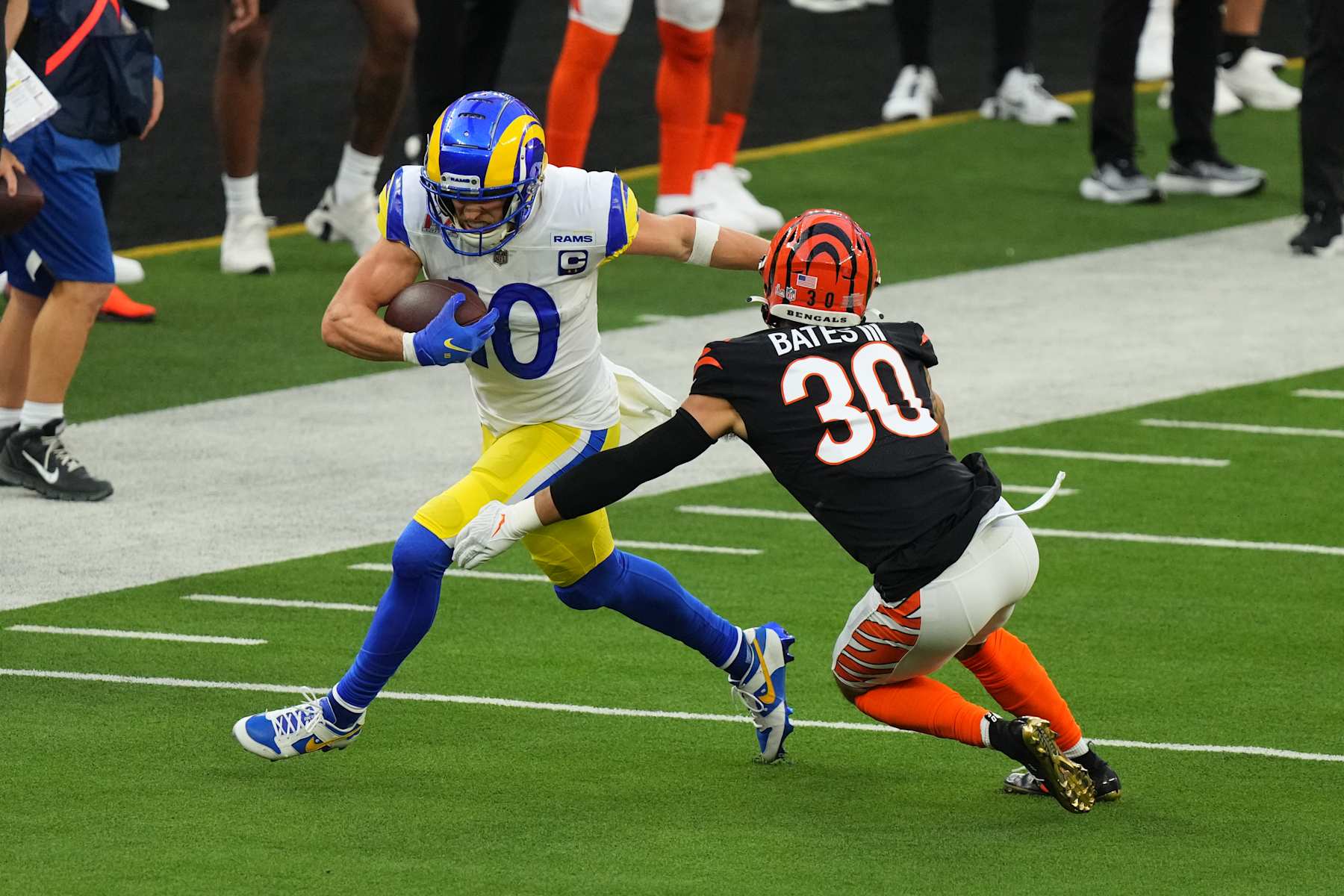 INGLEWOOD, CALIFORNIA - FEBRUARY 13: Cooper Kupp #10 of the Los Angeles Rams slips the tackle by Jessie Bates #30 of the Cincinnati Bengals during the NFL Super Bowl LVI football game at SoFi Stadium on February 13, 2022 in Inglewood, California. (Photo by Cooper Neill/Getty Images)