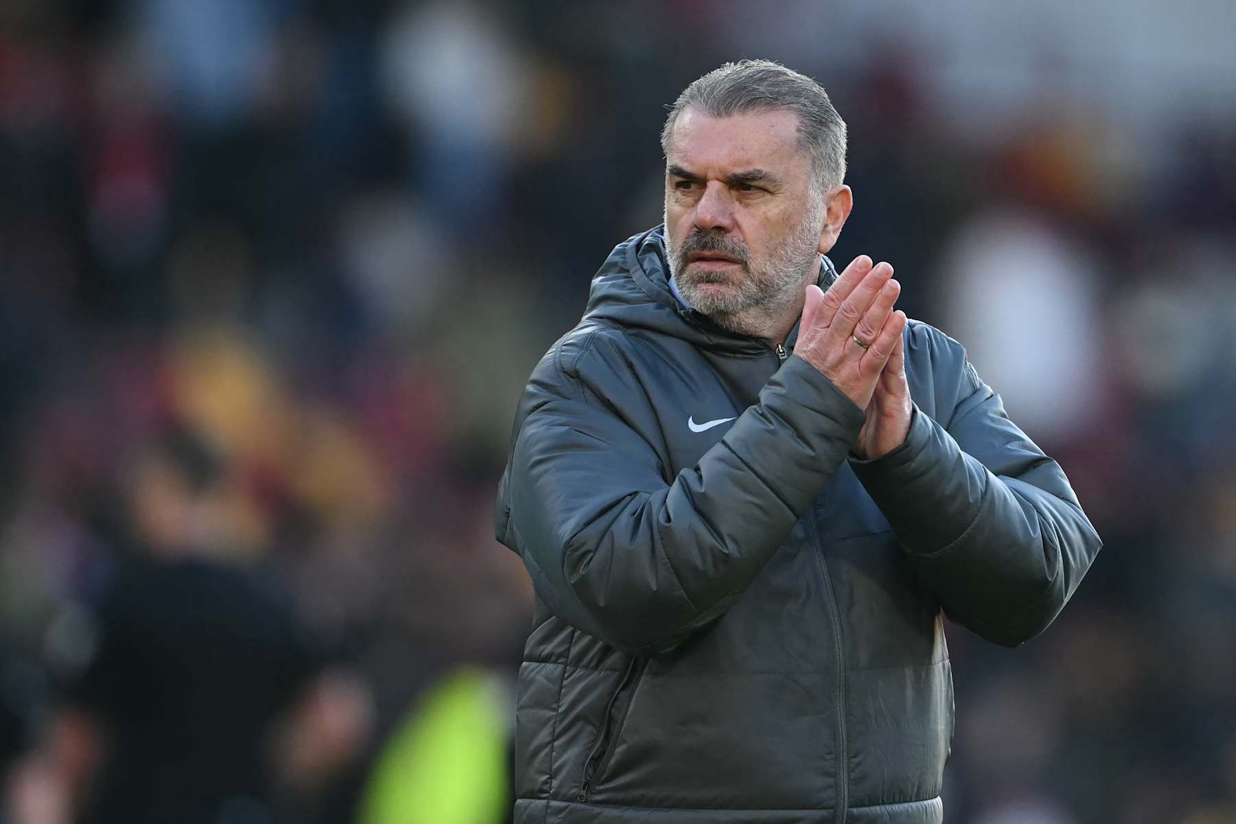 Tottenham Hotspur's Greek-Australian Head Coach Ange Postecoglou applauds fans on the pitch after the English Premier League football match between Brentford and Tottenham Hotspur at the Gtech Community Stadium in London on February 2, 2025. Spurs won the game 2-0. (Photo by JUSTIN TALLIS / AFP) / RESTRICTED TO EDITORIAL USE. No use with unauthorized audio, video, data, fixture lists, club/league logos or 'live' services. Online in-match use limited to 120 images. An additional 40 images may be used in extra time. No video emulation. Social media in-match use limited to 120 images. An additional 40 images may be used in extra time. No use in betting publications, games or single club/league/player publications. / (Photo by JUSTIN TALLIS/AFP via Getty Images)