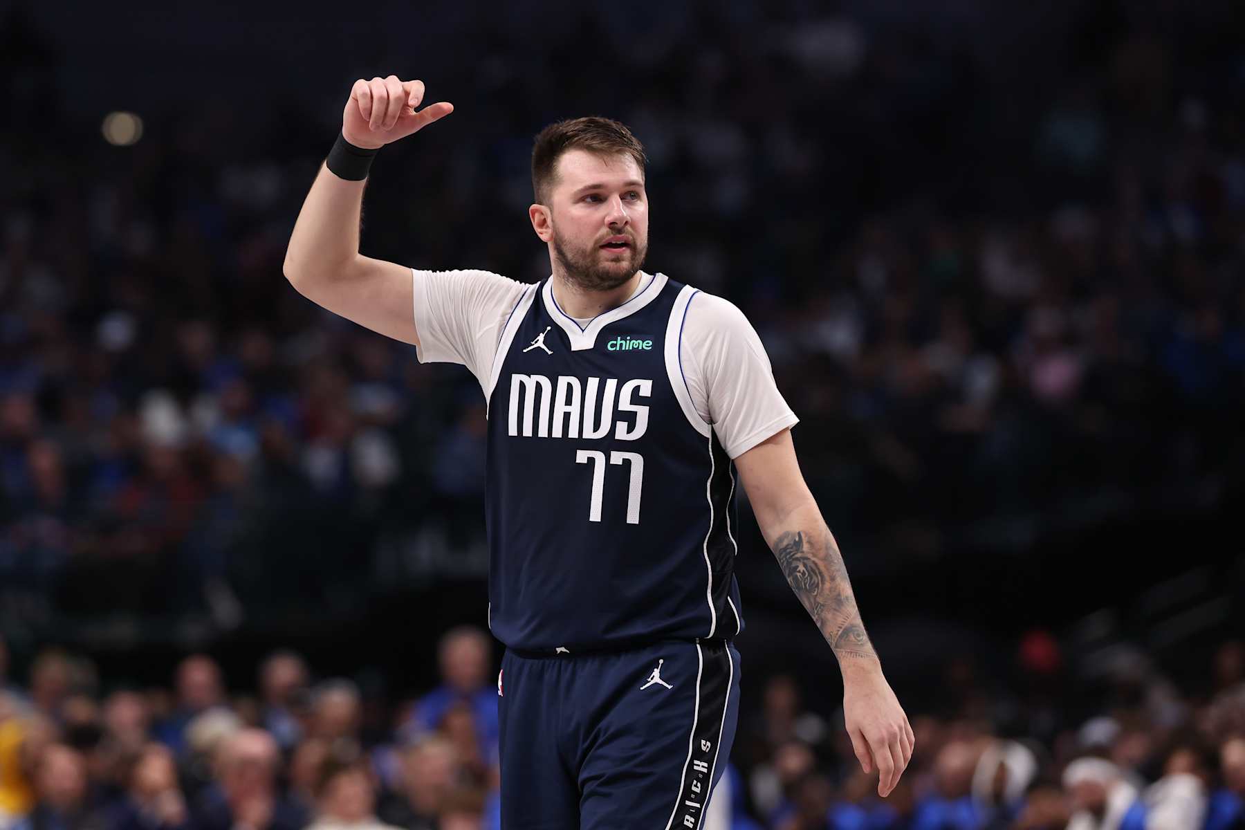 DALLAS, TEXAS - DECEMBER 23: Luka Doncic #77 of the Dallas Mavericks looks on during the first half against the Portland Trail Blazers at American Airlines Center on December 23, 2024 in Dallas, Texas. NOTE TO USER: User expressly acknowledges and agrees that, by downloading and/or using this photograph, user is consenting to the terms and conditions of the Getty Images License Agreement. (Photo by Sam Hodde/Getty Images)