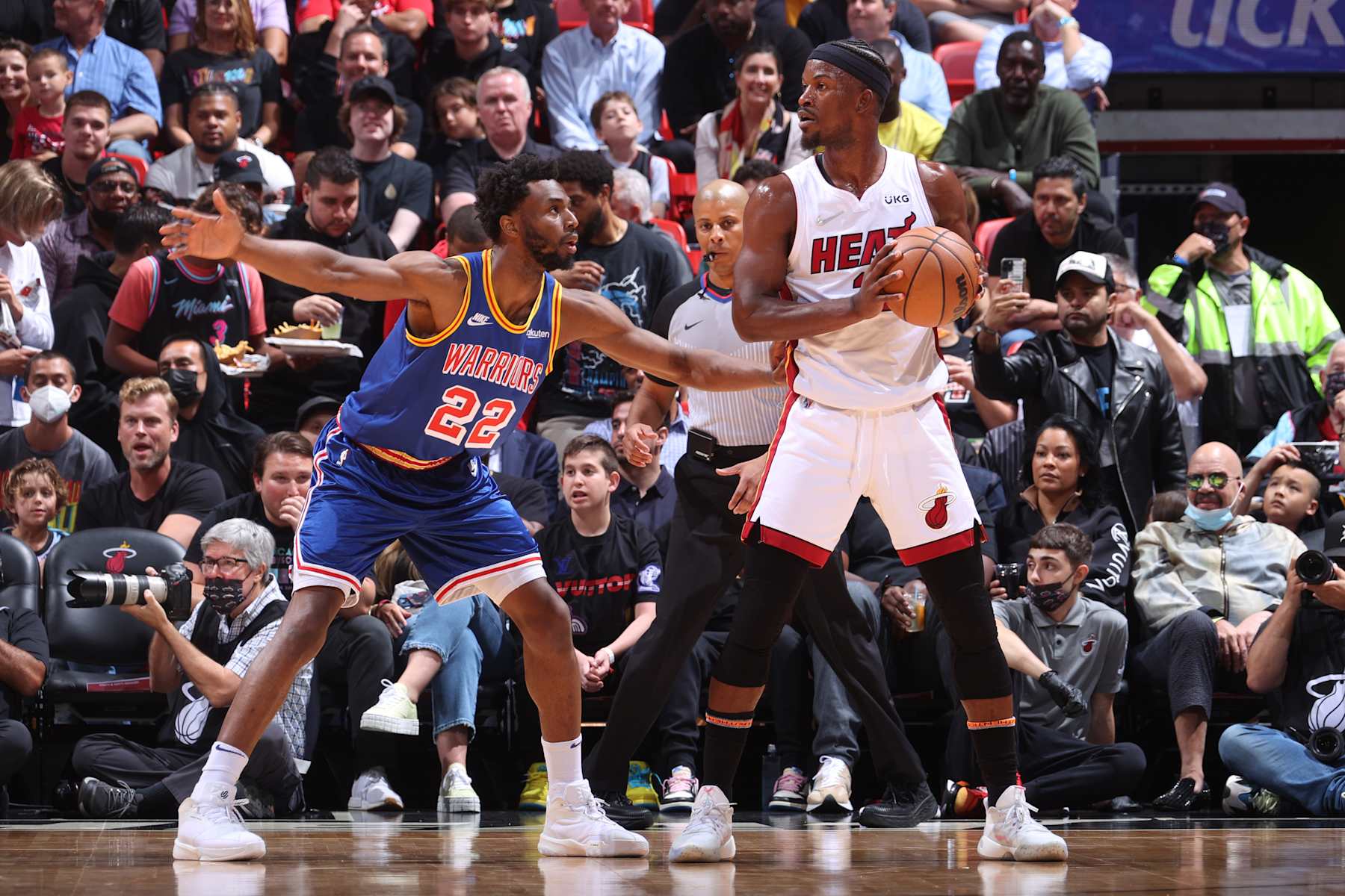 MIAMI, FL - MARCH 23: Andrew Wiggins #22 of the Golden State Warriors plays defense on Jimmy Butler #22 of the Miami Heat during the game on March 23, 2022 at FTX Arena in Miami, Florida. NOTE TO USER: User expressly acknowledges and agrees that, by downloading and or using this Photograph, user is consenting to the terms and conditions of the Getty Images License Agreement. Mandatory Copyright Notice: Copyright 2022 NBAE (Photo by Nathaniel S. Butler/NBAE via Getty Images)