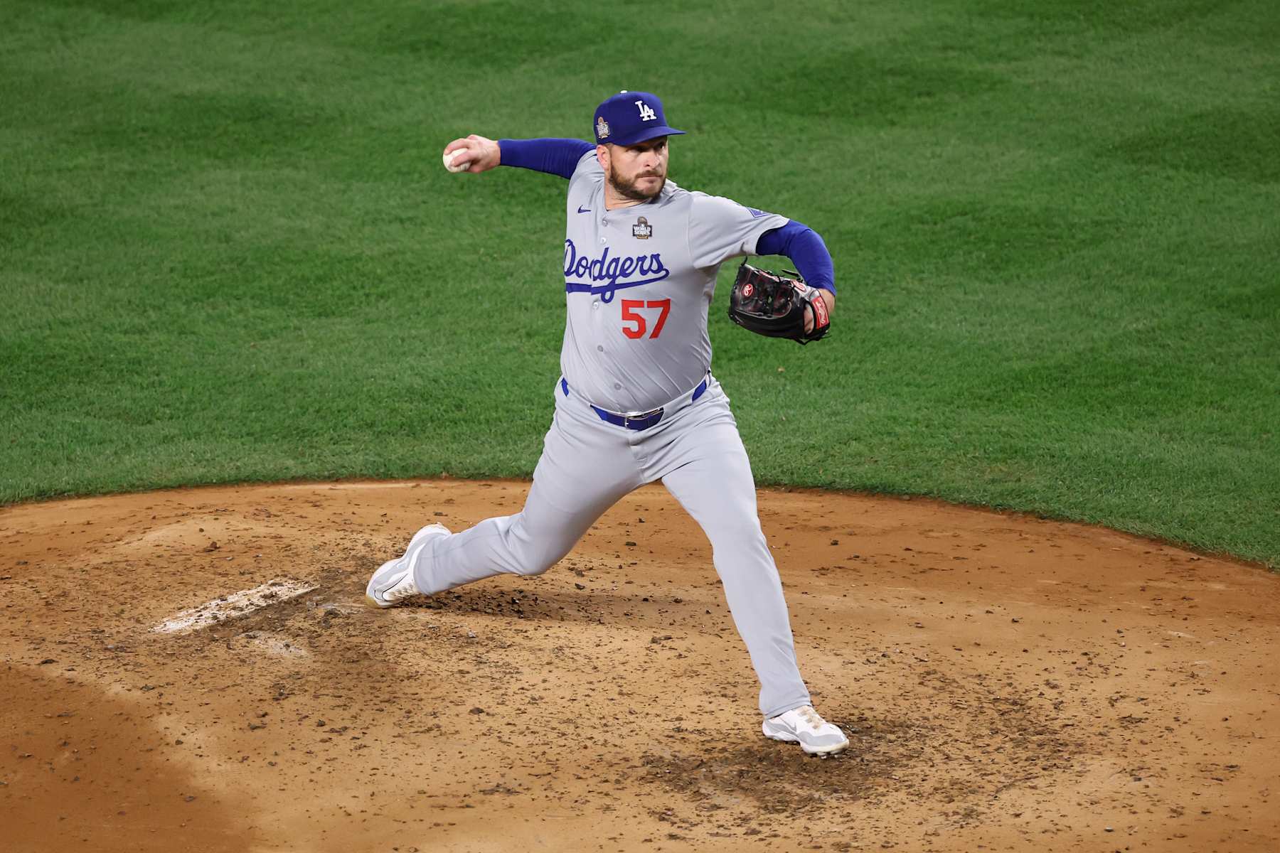 NEW YORK, NEW YORK - OCTOBER 30:  Ryan Brasier #57 of the Los Angeles Dodgers pitches during the third inning of Game Five of the 2024 World Series against the New York Yankees at Yankee Stadium on October 30, 2024 in the Bronx borough of New York City. (Photo by Luke Hales/Getty Images)