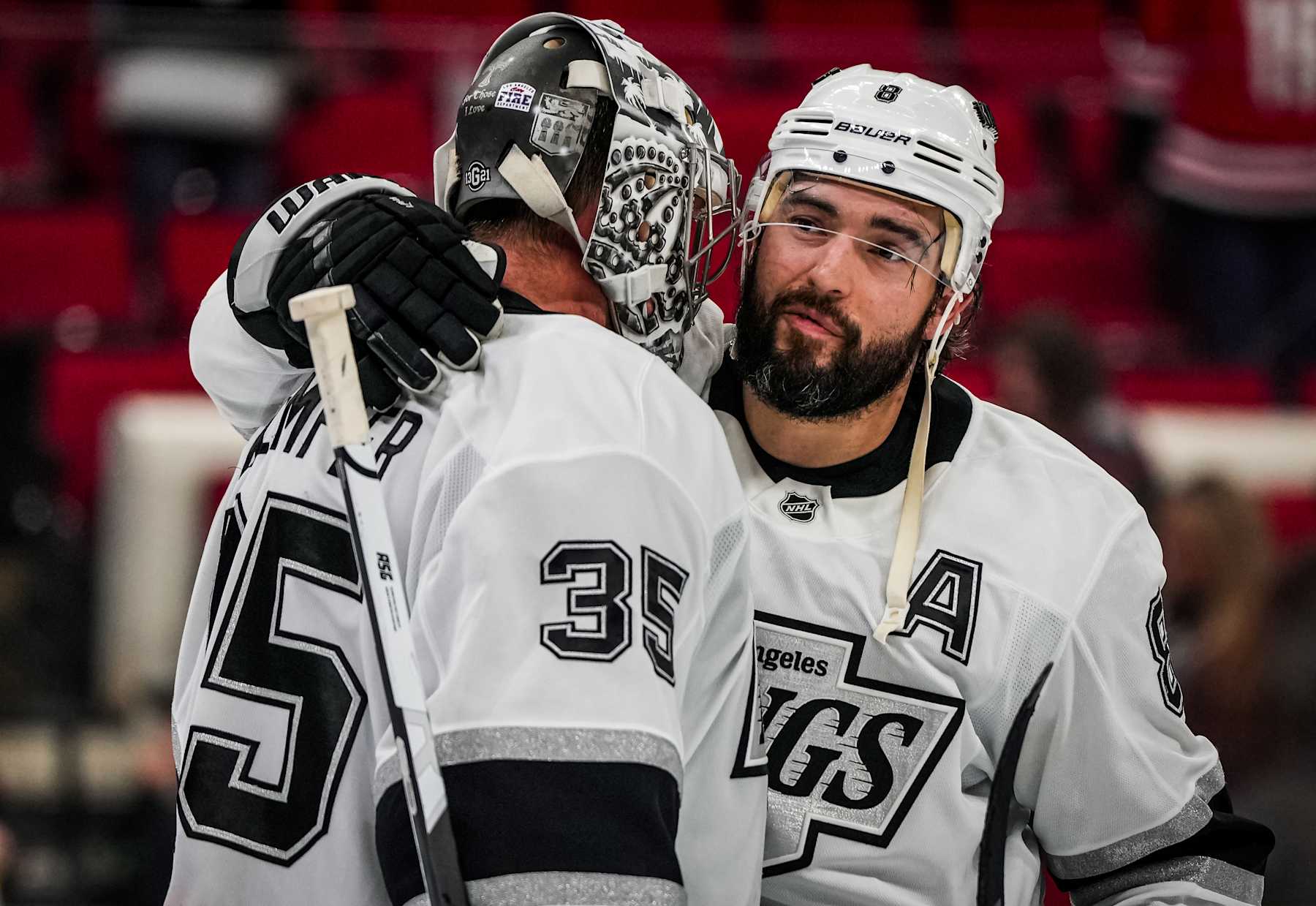 RALEIGH, NORTH CAROLINA - FEBRUARY 01: Darcy Kuemper #35 of the Los Angeles Kings celebrates with teammates after a 4-2 victory against the Los Angeles Kings at Lenovo Center on February 01, 2025 in Raleigh, North Carolina. (Photo by Josh Lavallee/NHLI via Getty Images)