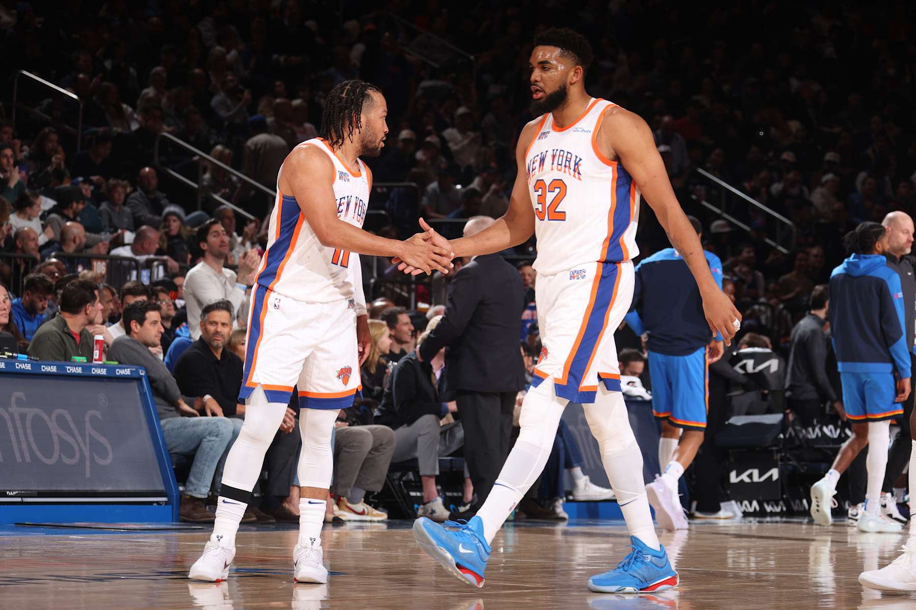 NEW YORK, NY - JANUARY 10:  Jalen Brunson #11 and Karl-Anthony Towns #32 of the New York Knicks high five during the game against the Oklahoma City Thunder  on January 10, 2025 at Madison Square Garden in New York City, New York.  NOTE TO USER: User expressly acknowledges and agrees that, by downloading and or using this photograph, User is consenting to the terms and conditions of the Getty Images License Agreement. Mandatory Copyright Notice: Copyright 2024 NBAE  (Photo by Nathaniel S. Butler/NBAE via Getty Images)