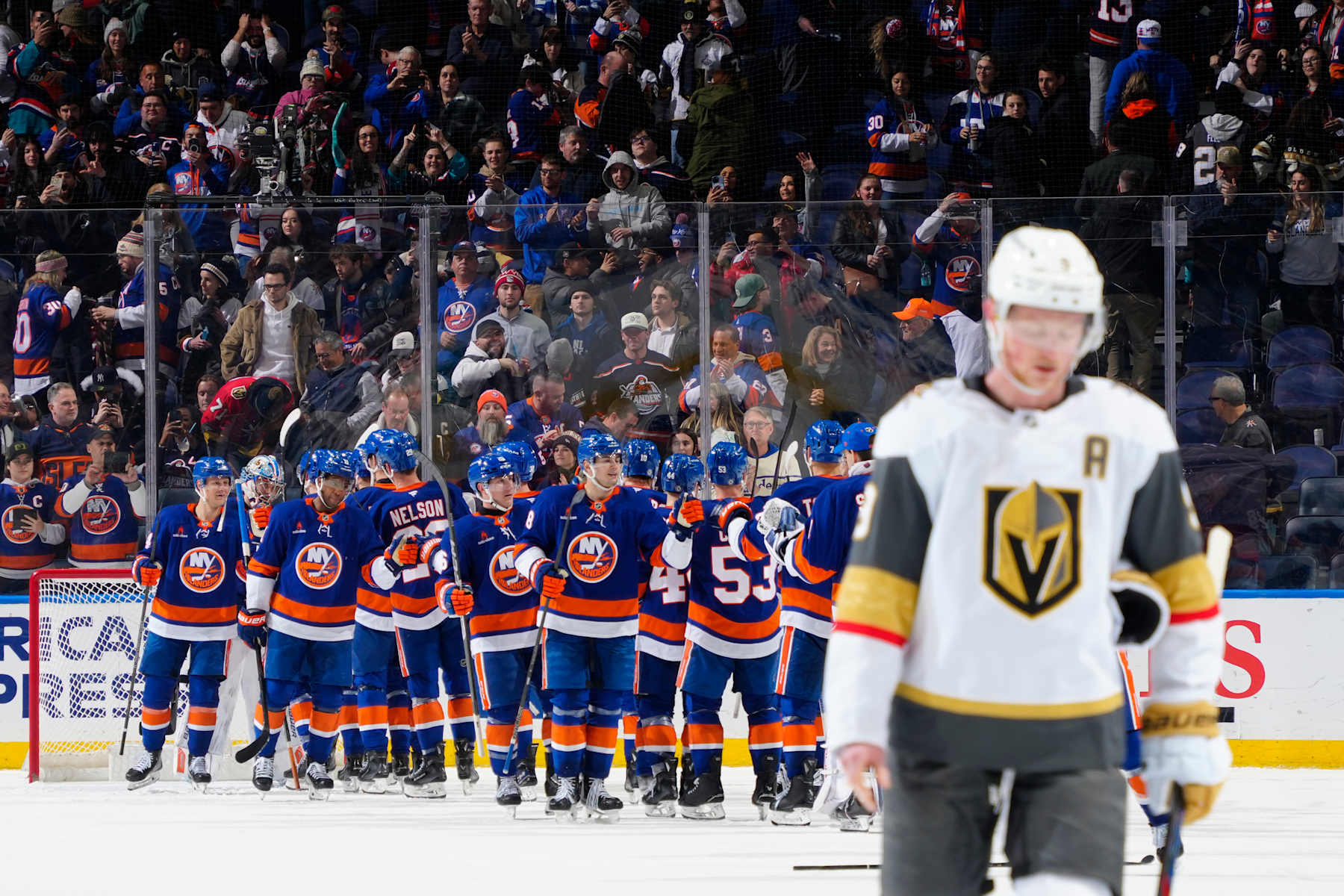 ELMONT, NEW YORK - FEBRUARY 04: Alex Pietrangelo #7 of the Vegas Golden Knights reacts as the New York Islanders celebrate their win at UBS Arena on February 04, 2025 in Elmont, New York. (Photo by Mike Stobe/NHLI via Getty Images)