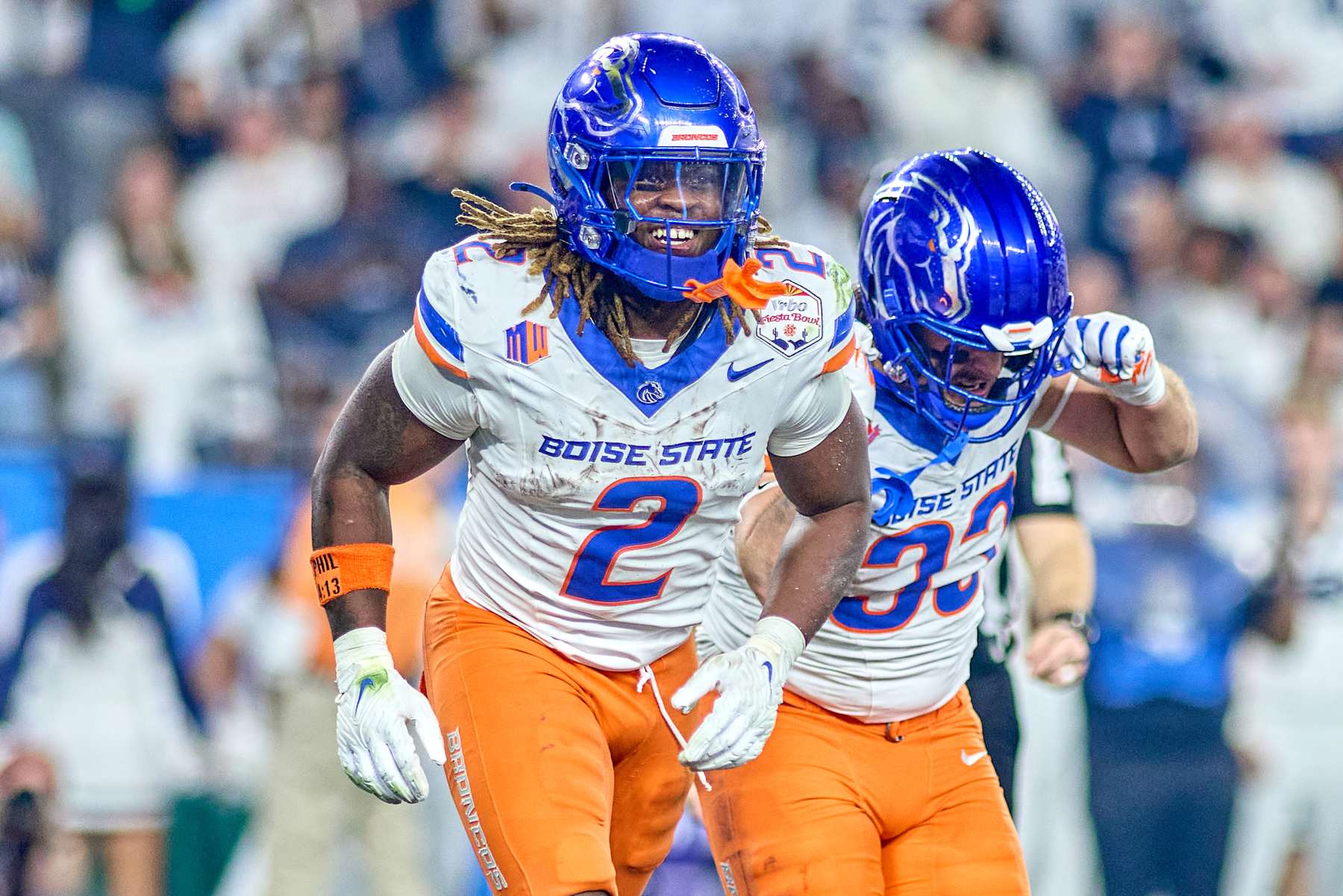 GLENDALE, ARIZONA - DECEMBER 31: Boise State Broncos wide receiver Latrell Caples (3) celebrates with running back Ashton Jeanty (2) after scoring a touchdown in action during the 2024 Vrbo Fiesta Bowl between the Penn State Nittany Lions and Boise State Broncos at State Farm Stadium on December 31, 2024 in Glendale, Arizona. (Photo by Robin Alam/ISI Photos/Getty Images)