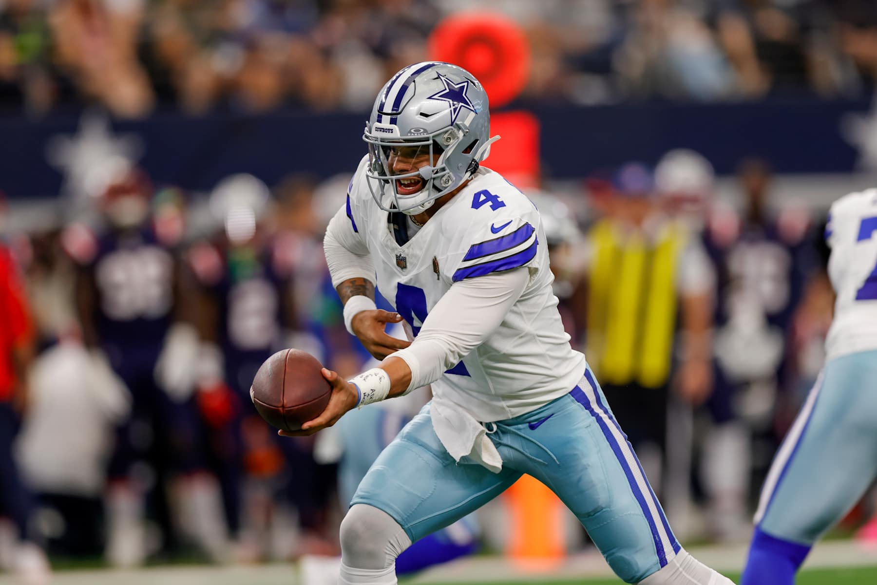 ARLINGTON, TX - OCTOBER 01: Dallas Cowboys quarterback Dak Prescott (4) looks to hand-off the football during the game between the Dallas Cowboys and the New England Patriots on October 01, 2023 at AT&T Stadium in Arlington, Texas. (Photo by Matthew Pearce/Icon Sportswire via Getty Images)