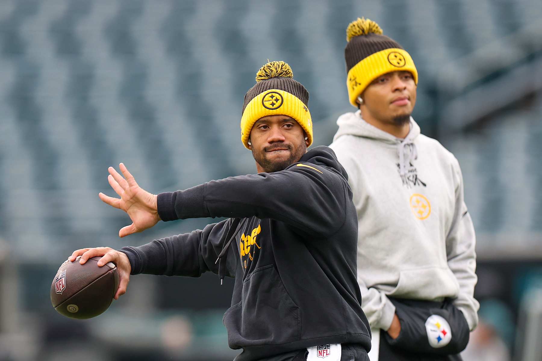 PHILADELPHIA, PENNSYLVANIA - DECEMBER 15: Russell Wilson #3 and Justin Fields #2 of the Pittsburgh Steelers warm up before the game against the Philadelphia Eagles at Lincoln Financial Field on December 15, 2024 in Philadelphia, Pennsylvania. (Photo by Emilee Chinn/Getty Images)