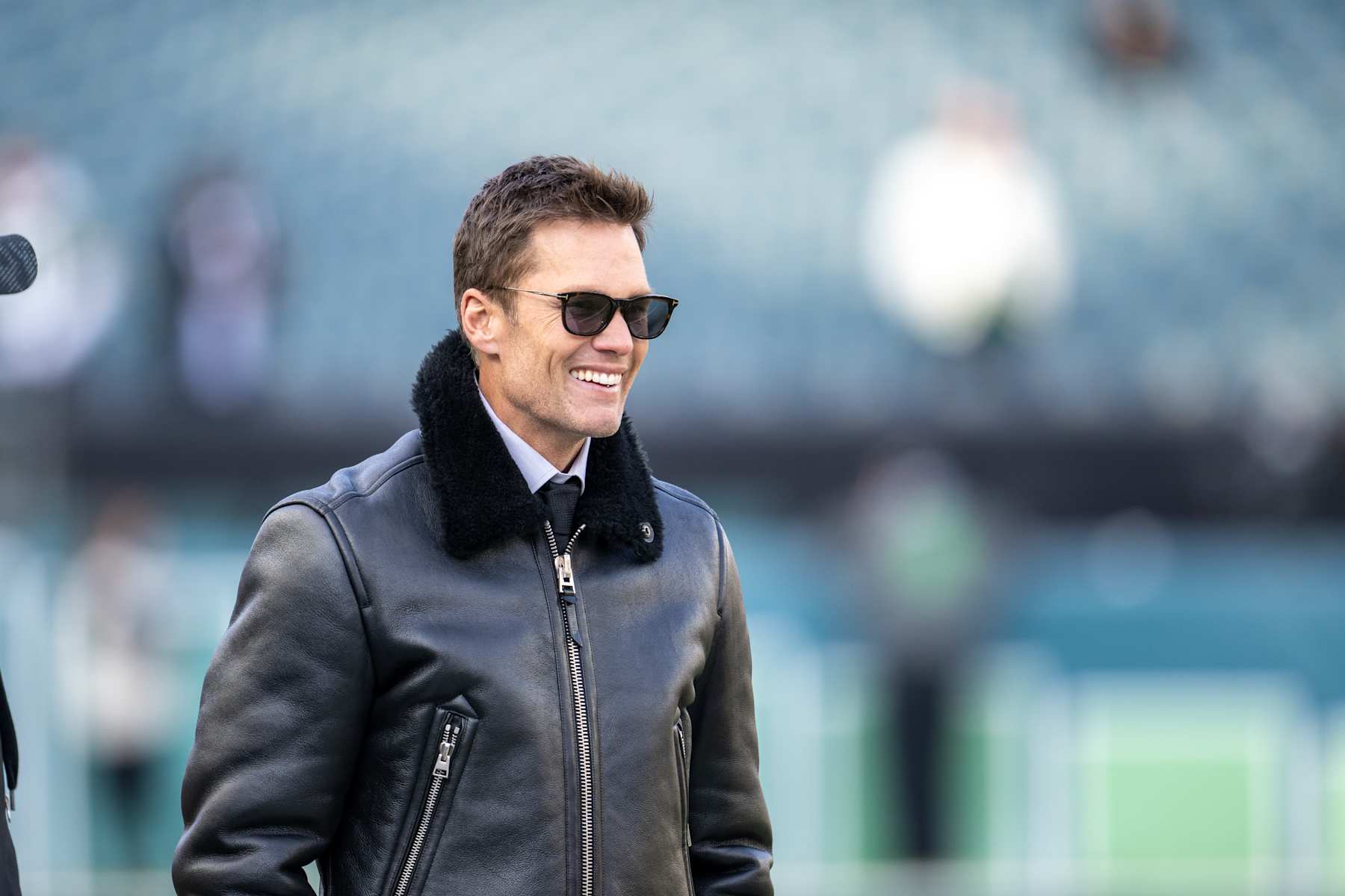 PHILADELPHIA, PA - JANUARY 12: NFL legend and Fox commentator Tom Brady smiles before the NFC Wild Card playoff game between the Green Bay Packers and the Philadelphia Eagles on January 12th, 2025 at Lincoln Financial Field in Philadelphia, PA. (Photo by Terence Lewis/Icon Sportswire via Getty Images)