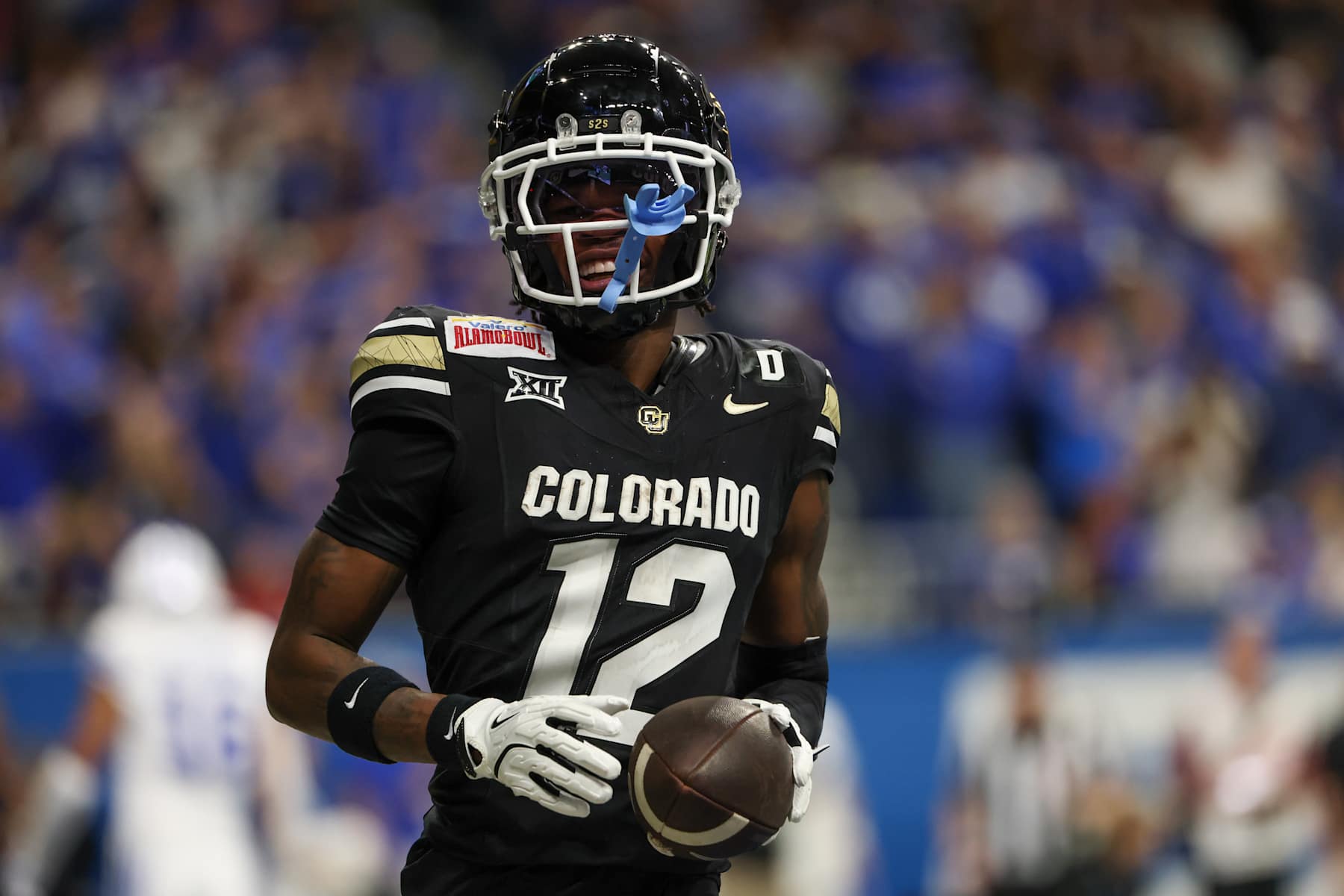 SAN ANTONIO, TX - DECEMBER 28: Colorado Buffaloes wide receiver Travis Hunter (12) smiles after scoring a touchdown during the football game between BYU Cougars and Colorado Buffalos on December 28, 2024, at the Alamodome in San Antonio, Texas. (Photo by David Buono/Icon Sportswire via Getty Images)