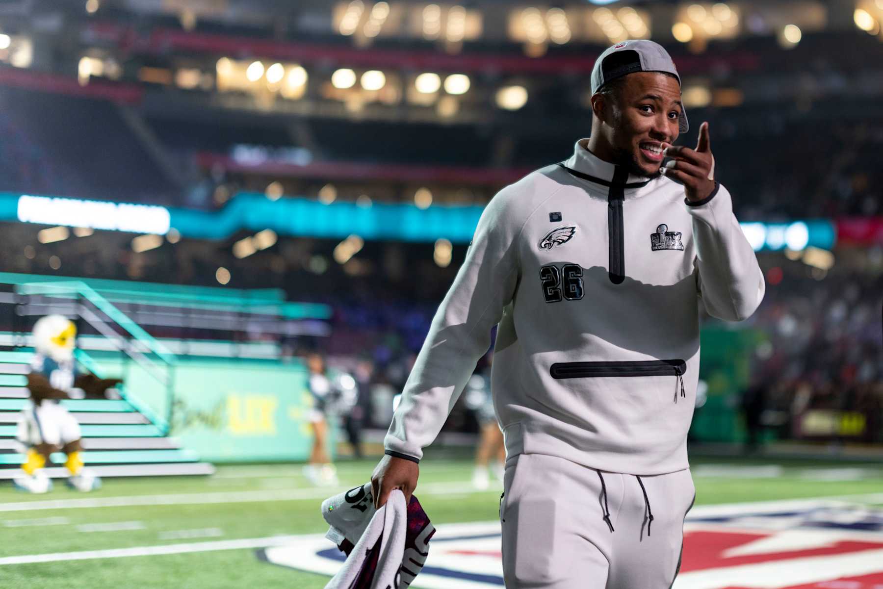 NEW ORLEANS, LOUISIANA - FEBRUARY 3: Saquon Barkley #26 of the Philadelphia Eagles reacts as he walks to his booth during Super Bowl LIX Opening Night on February 02, 2025 in New Orleans, Louisiana. (Photo by Michael Owens/Getty Images)