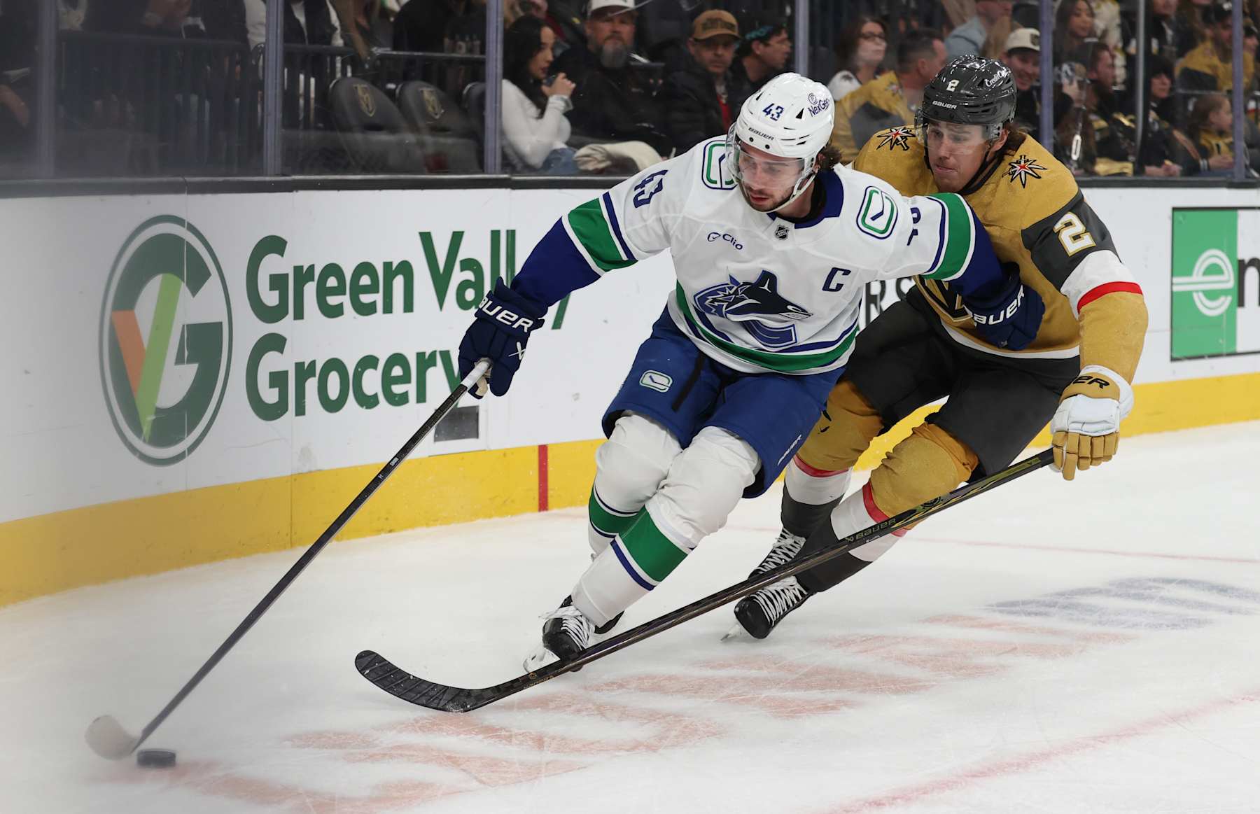 LAS VEGAS, NEVADA - DECEMBER 19: Quinn Hughes #43 of the Vancouver Canucks skates against Zach Whitecloud #2 of the Vegas Golden Knights during the third period at T-Mobile Arena on December 19, 2024 in Las Vegas, Nevada. (Photo by Zak Krill/NHLI via Getty Images)