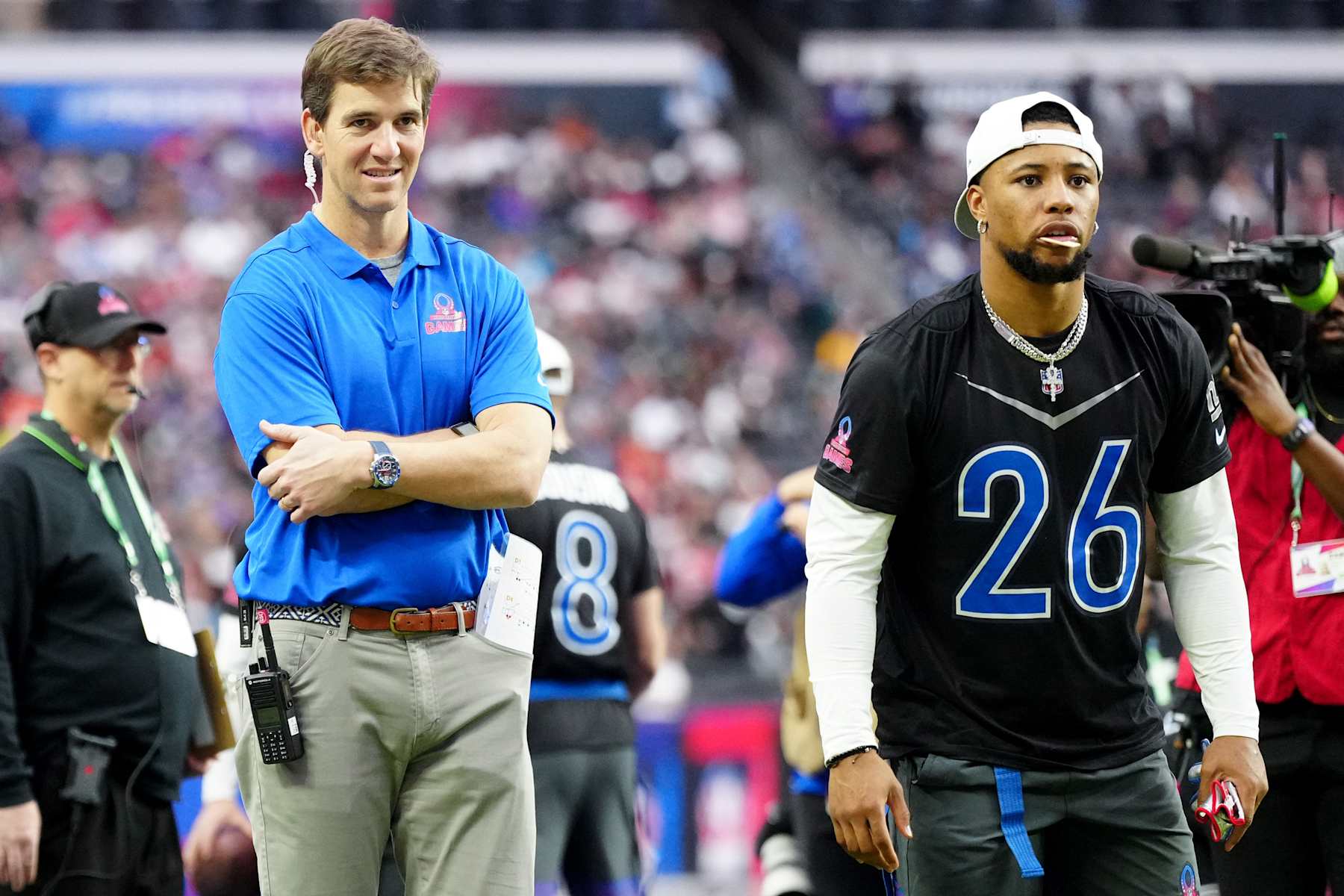 LAS VEGAS, NEVADA - FEBRUARY 05: NFC head coach Eli Manning and Saquon Barkley #26 of the New York Giants and NFC look on during the 2023 NFL Pro Bowl Games at Allegiant Stadium on February 05, 2023 in Las Vegas, Nevada. (Photo by Jeff Bottari/Getty Images)
