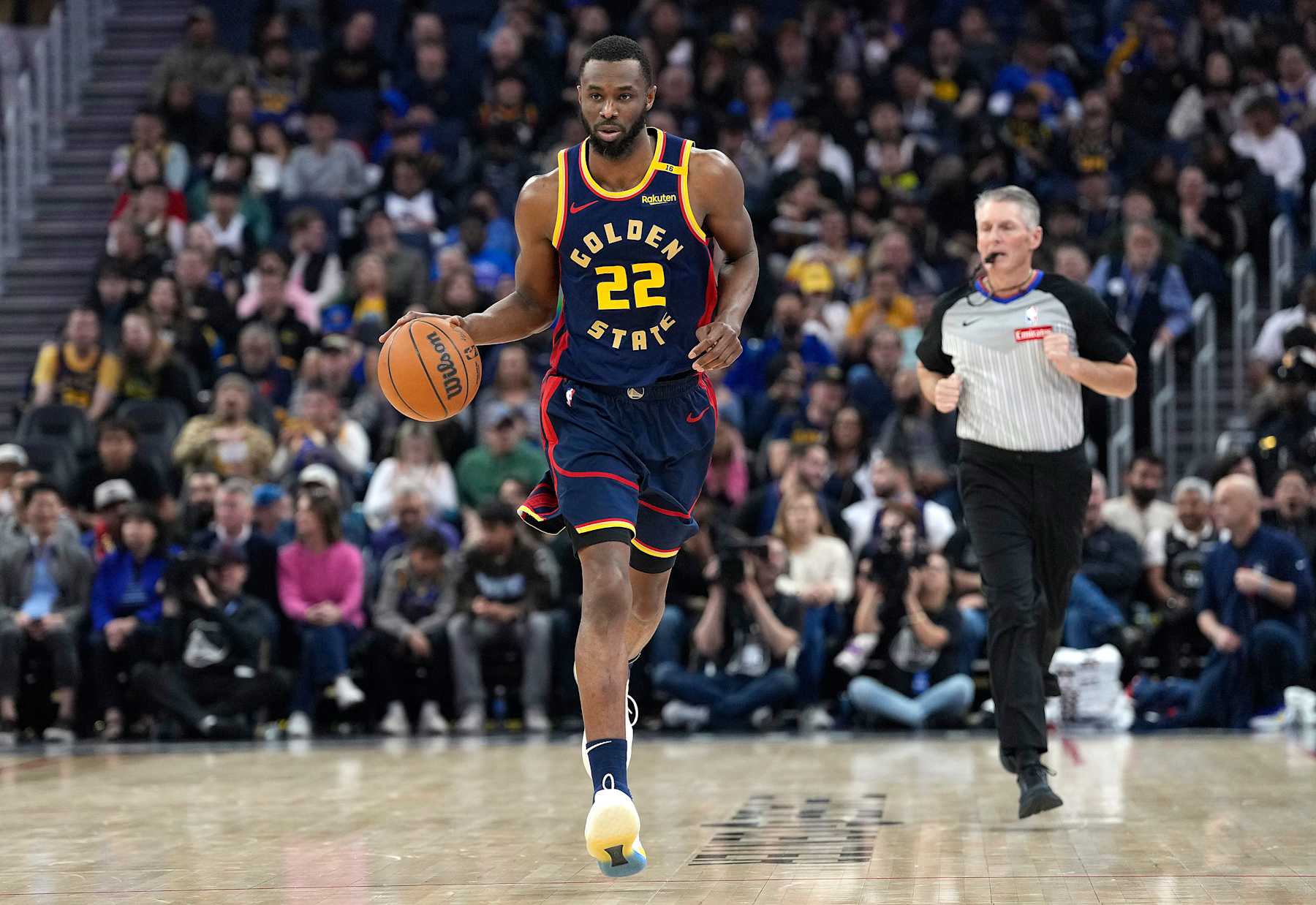 SAN FRANCISCO, CALIFORNIA - JANUARY 31: Andrew Wiggins #22 of the Golden State Warriors dribbles the ball up court against the Phoenix Suns during the first half of an NBA basketball game at Chase Center on January 31, 2025 in San Francisco, California. NOTE TO USER: User expressly acknowledges and agrees that, by downloading and or using this photograph, User is consenting to the terms and conditions of the Getty Images License Agreement. (Photo by Thearon W. Henderson/Getty Images)