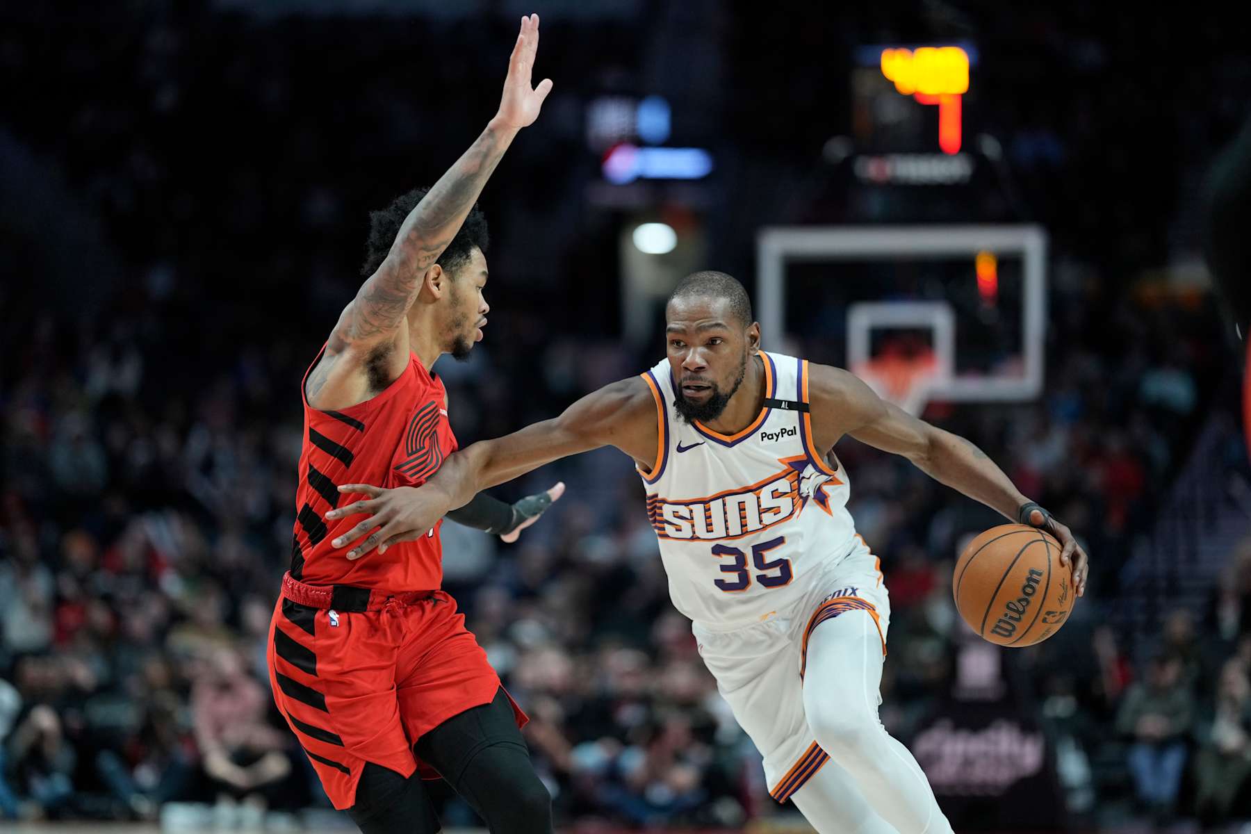 PORTLAND, OREGON - FEBRUARY 03: Kevin Durant #35 of the Phoenix Suns drives against Anfernee Simons #1 of the Portland Trail Blazers during overtime at Moda Center on February 03, 2025 in Portland, Oregon. NOTE TO USER: User expressly acknowledges and agrees that, by downloading and or using this photograph, User is consenting to the terms and conditions of the Getty Images License Agreement. (Photo by Soobum Im/Getty Images)
