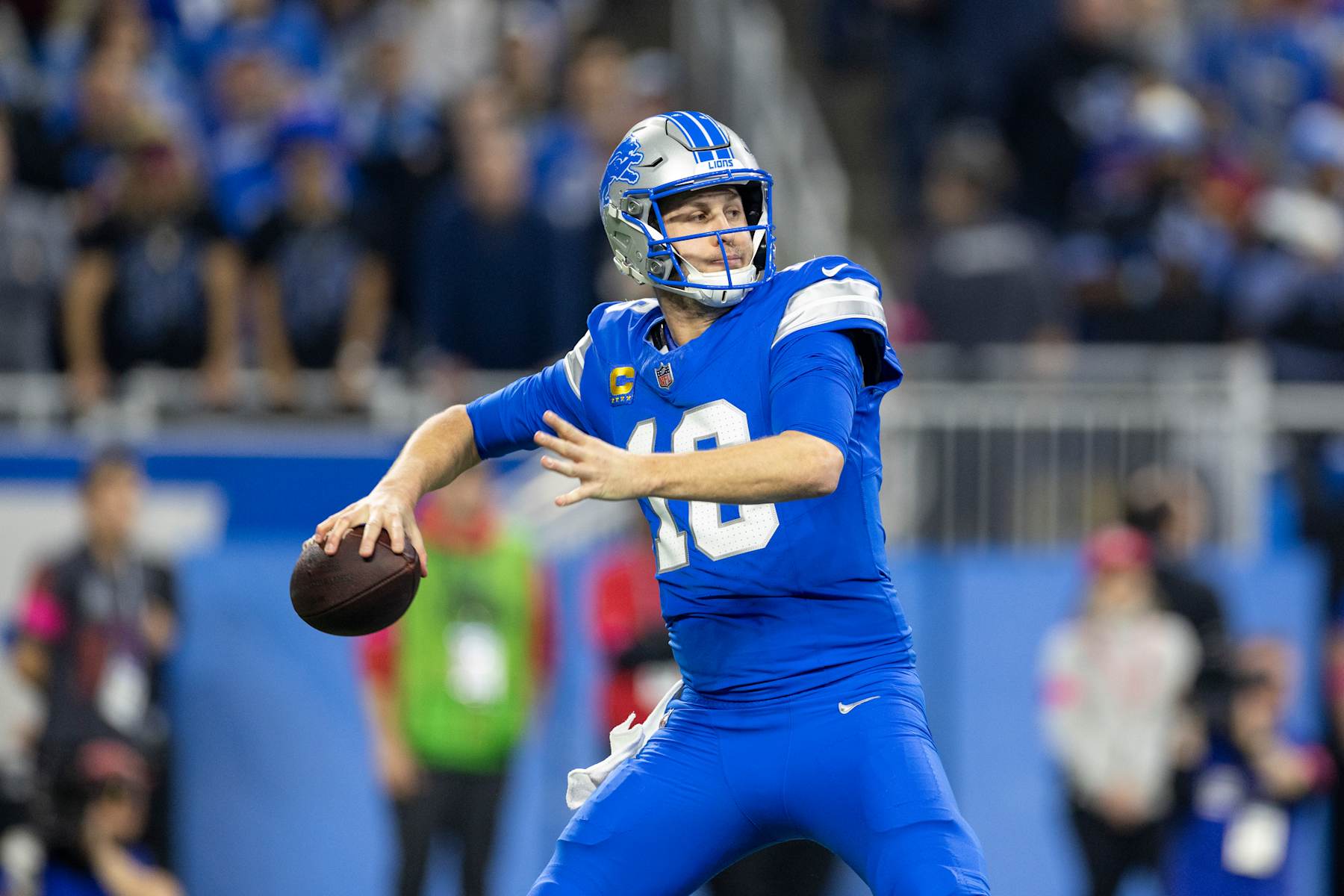 DETROIT, MICHIGAN - JANUARY 18: Jared Goff #16 of the Detroit Lions looks to pass during an NFL Football game against the Washington Commanders at Ford Field on January 18, 2025 in Detroit, Michigan. (Photo by Michael Owens/Getty Images)