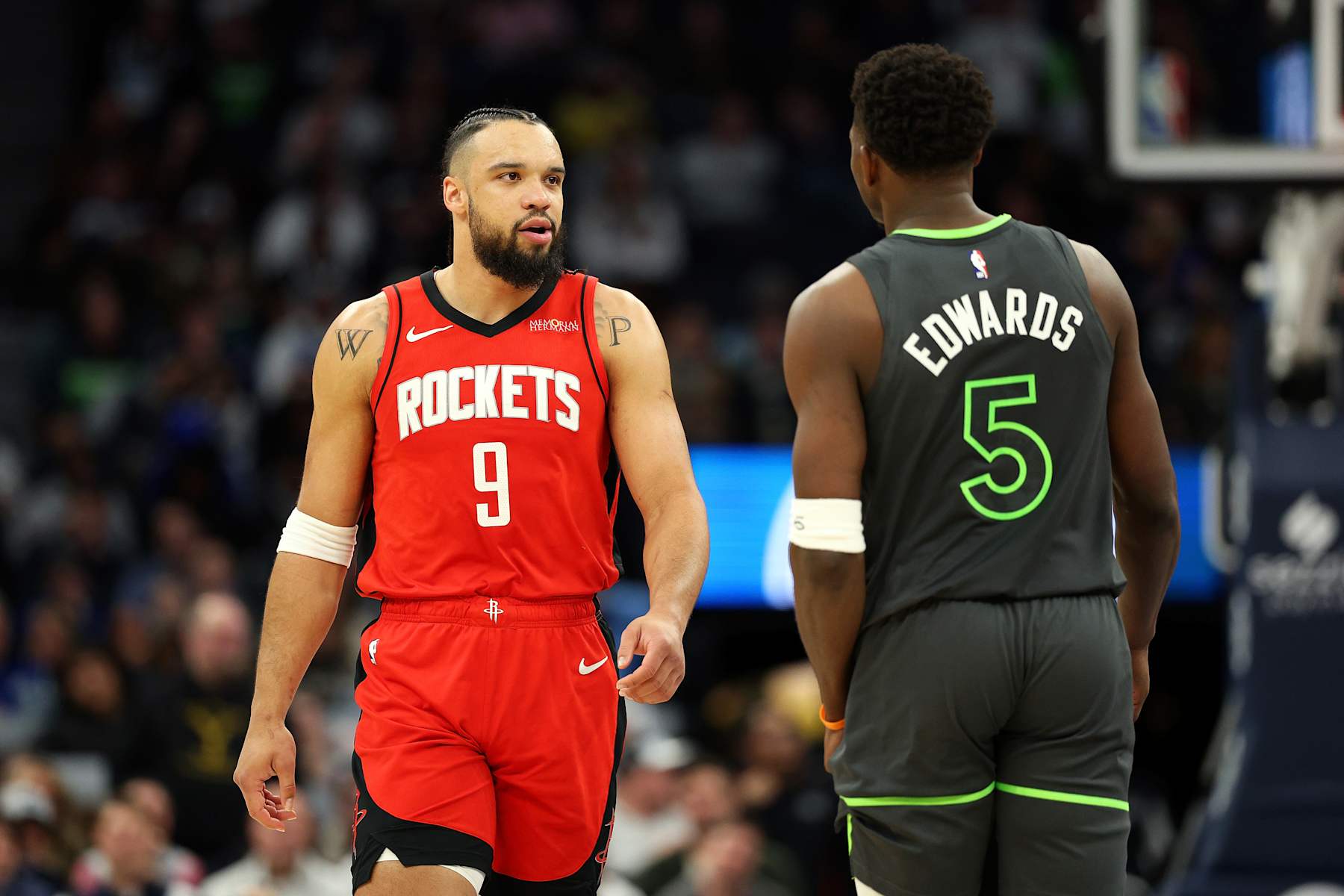 MINNEAPOLIS, MINNESOTA - FEBRUARY 06: Dillon Brooks #9 of the Houston Rockets interacts with Anthony Edwards #5 of the Minnesota Timberwolves in the second quarter at Target Center on February 06, 2025 in Minneapolis, Minnesota. NOTE TO USER: User expressly acknowledges and agrees that, by downloading and or using this photograph, User is consenting to the terms and conditions of the Getty Images License Agreement. (Photo by David Berding/Getty Images)