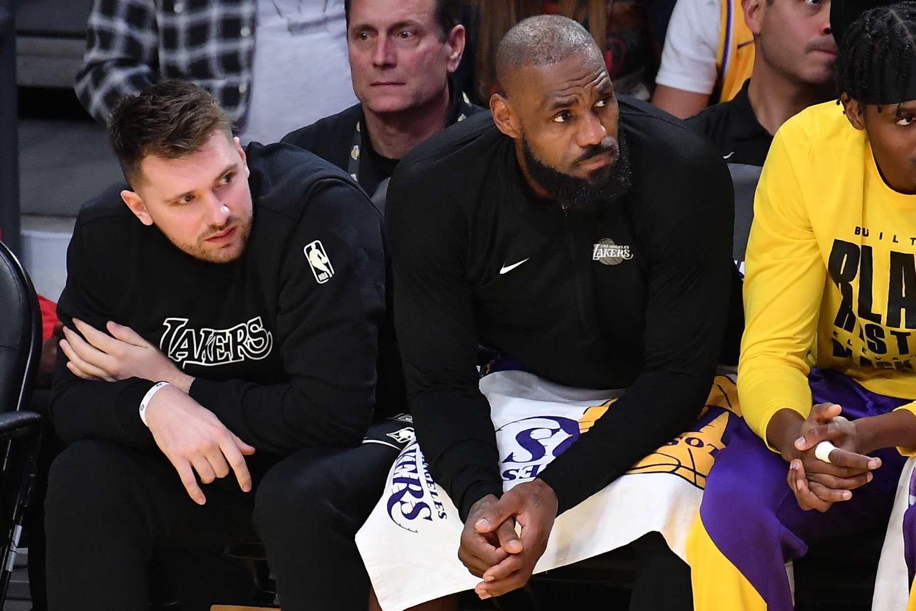 LOS ANGELES, CALIFORNIA - FEBRUARY 06: Luka Doncic sits next to LeBron James during a basketball game between the Los Angeles Lakers and the Golden State Warriors at Crypto.com Arena on February 06, 2025 in Los Angeles, California. NOTE TO USER: User expressly acknowledges and agrees that, by downloading and or using this photograph, User is consenting to the terms and conditions of the Getty Images License Agreement. (Photo by Allen Berezovsky/Getty Images)