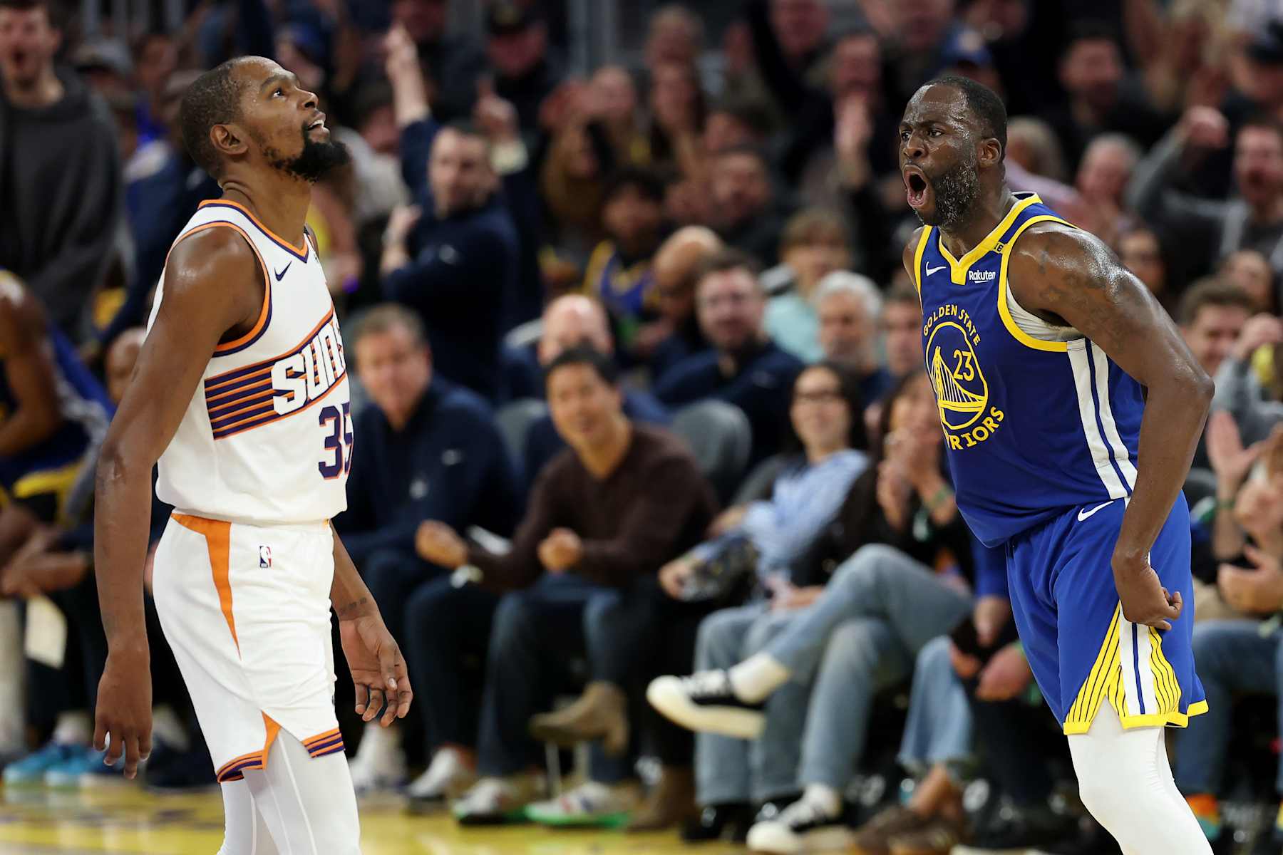 SAN FRANCISCO, CALIFORNIA - DECEMBER 28: Draymond Green #23 of the Golden State Warriors reacts after he made a three-point basket over Kevin Durant #35 of the Phoenix Suns in the first half at Chase Center on December 28, 2024 in San Francisco, California. NOTE TO USER: User expressly acknowledges and agrees that, by downloading and/or using this photograph, user is consenting to the terms and conditions of the Getty Images License Agreement.   (Photo by Ezra Shaw/Getty Images)