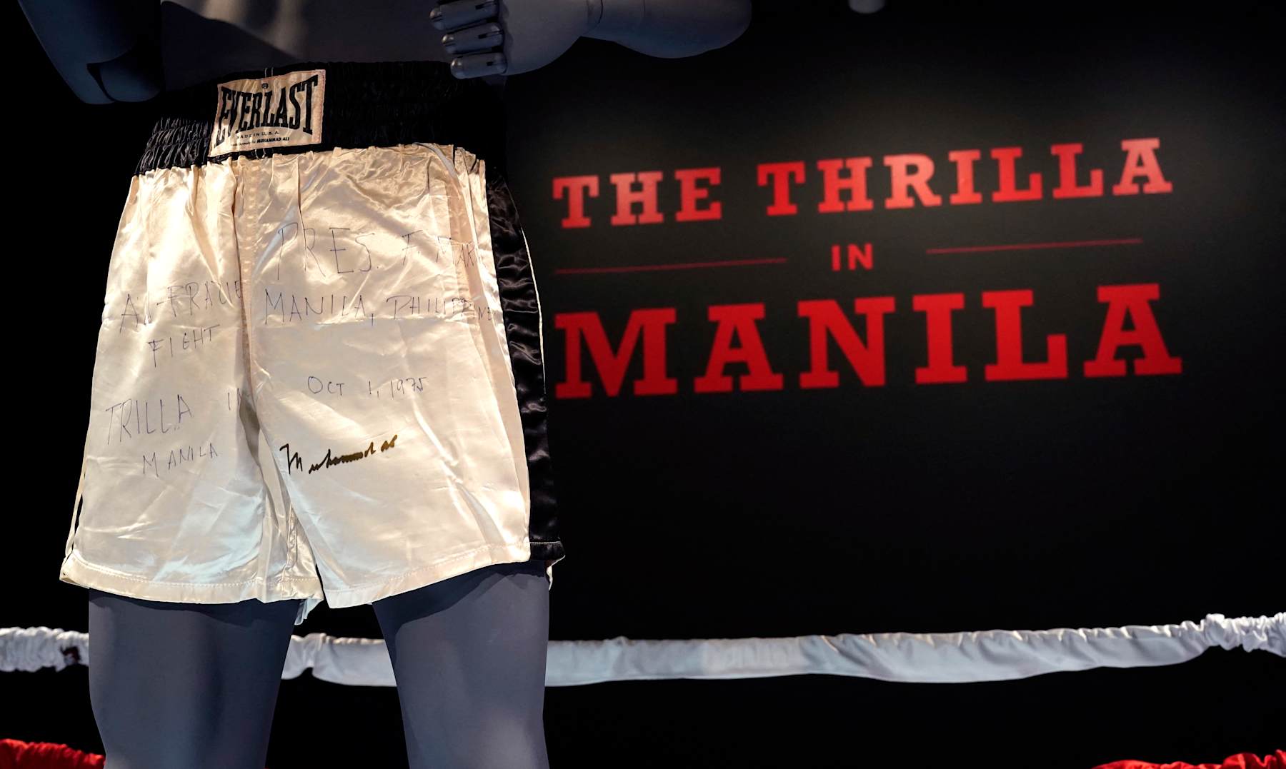 Muhammad Ali's trunks worn during the 1975 legendary match against Joe Frazier, 'The Thrilla in Manila' are on display during 'Sports Week' auctions at Sotheby's in New York City on April 4, 2024. The shorts worn by Muhammad Ali in his legendary "Thrilla in Manila" boxing match are up for grabs at Sotheby's in New York, part of a growing sports memorabilia market eyed by auction houses.
Bids -- including the latest for $3.8 million -- have been rolling in since late March for the Everlast-brand shorts, which are white with black stripes and are signed by Ali. (Photo by TIMOTHY A. CLARY / AFP) (Photo by TIMOTHY A. CLARY/AFP via Getty Images)