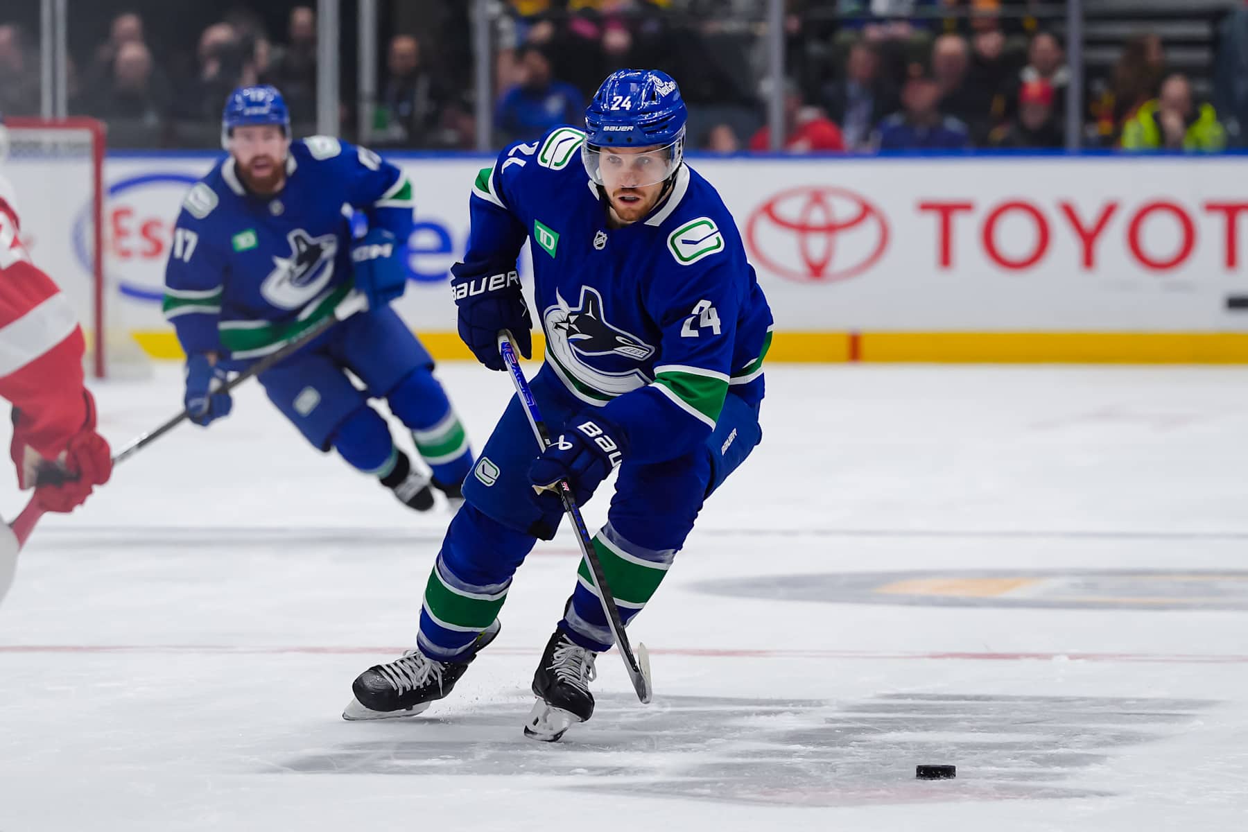 VANCOUVER, CANADA - FEBRUARY 2: Pius Suter #24 of the Vancouver Canucks skates with the puck during the third period of their NHL game against the Detroit Red Wings at Rogers Arena on February 2, 2025 in Vancouver, British Columbia, Canada. (Photo by Derek Cain/Getty Images)