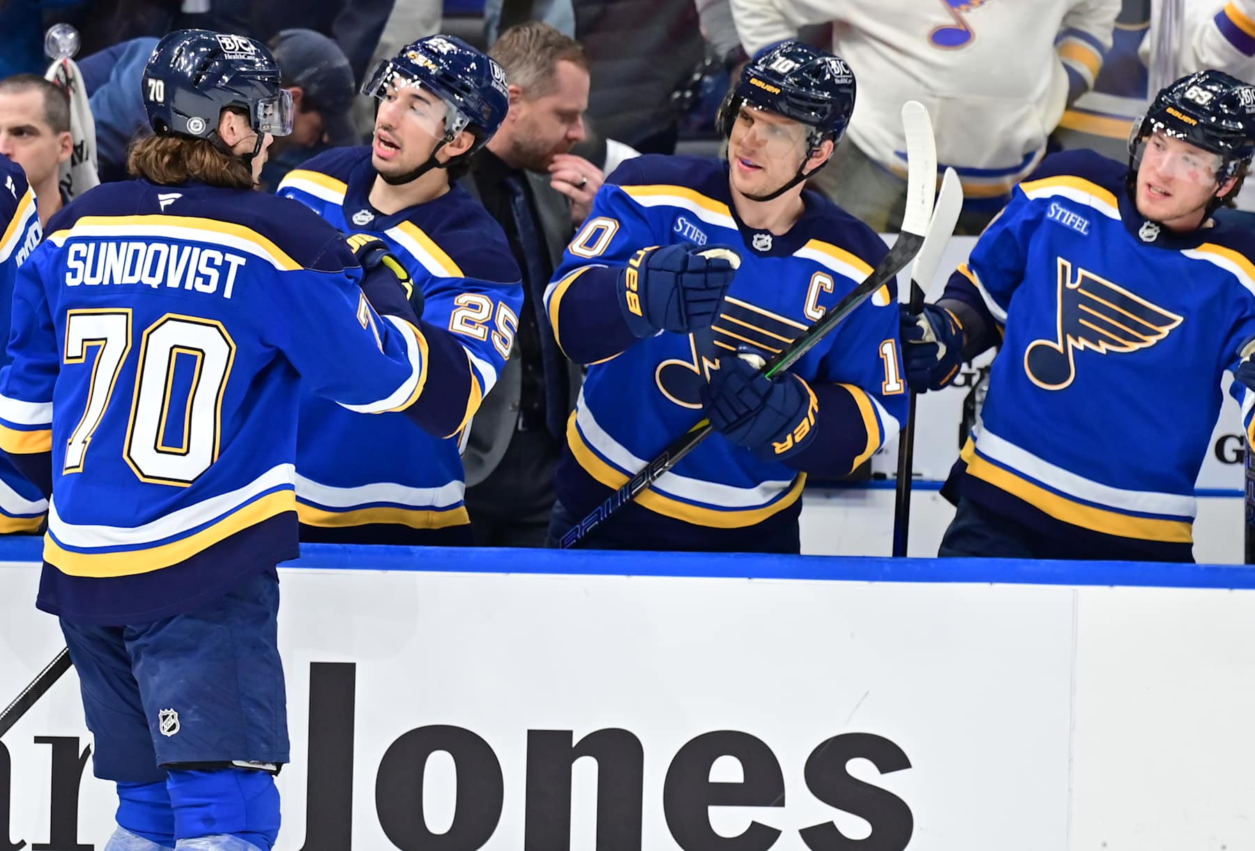 ST. LOUIS, MO - FEBRUARY 06 - St. Louis Blues center Oskar Sundqvist (70) is congratulated by teammates after scoring during a NHL game between the Florida Panthers and the St. Louis Blues on February 06, 2025, at Enterprise Center, St. Louis, MO. (Photo by Keith Gillett/Icon Sportswire via Getty Images)