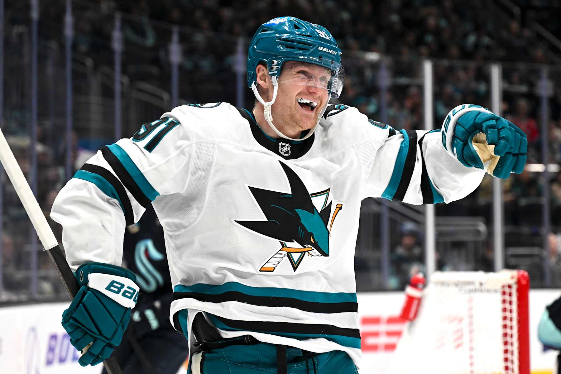 SEATTLE, WASHINGTON - JANUARY 30: Carl Grundstrom #91 of the San Jose Sharks reacts after scoring a goal during the first period against the Seattle Kraken at Climate Pledge Arena on January 30, 2025 in Seattle, Washington. (Photo by Alika Jenner/Getty Images)