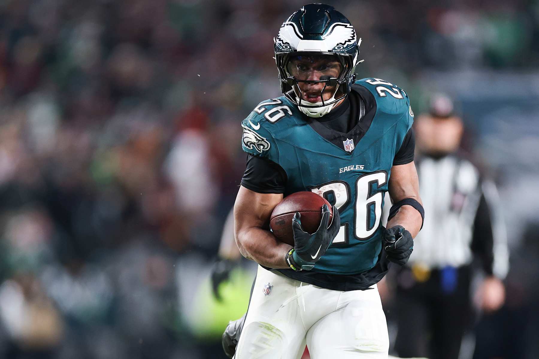 PHILADELPHIA, PENNSYLVANIA - JANUARY 26: Saquon Barkley #26 of the Philadelphia Eagles runs with the football during the fourth quarter in the NFC Championship Game against the Washington Commanders at Lincoln Financial Field on January 26, 2025 in Philadelphia, Pennsylvania. (Photo by Kathryn Riley/Getty Images)